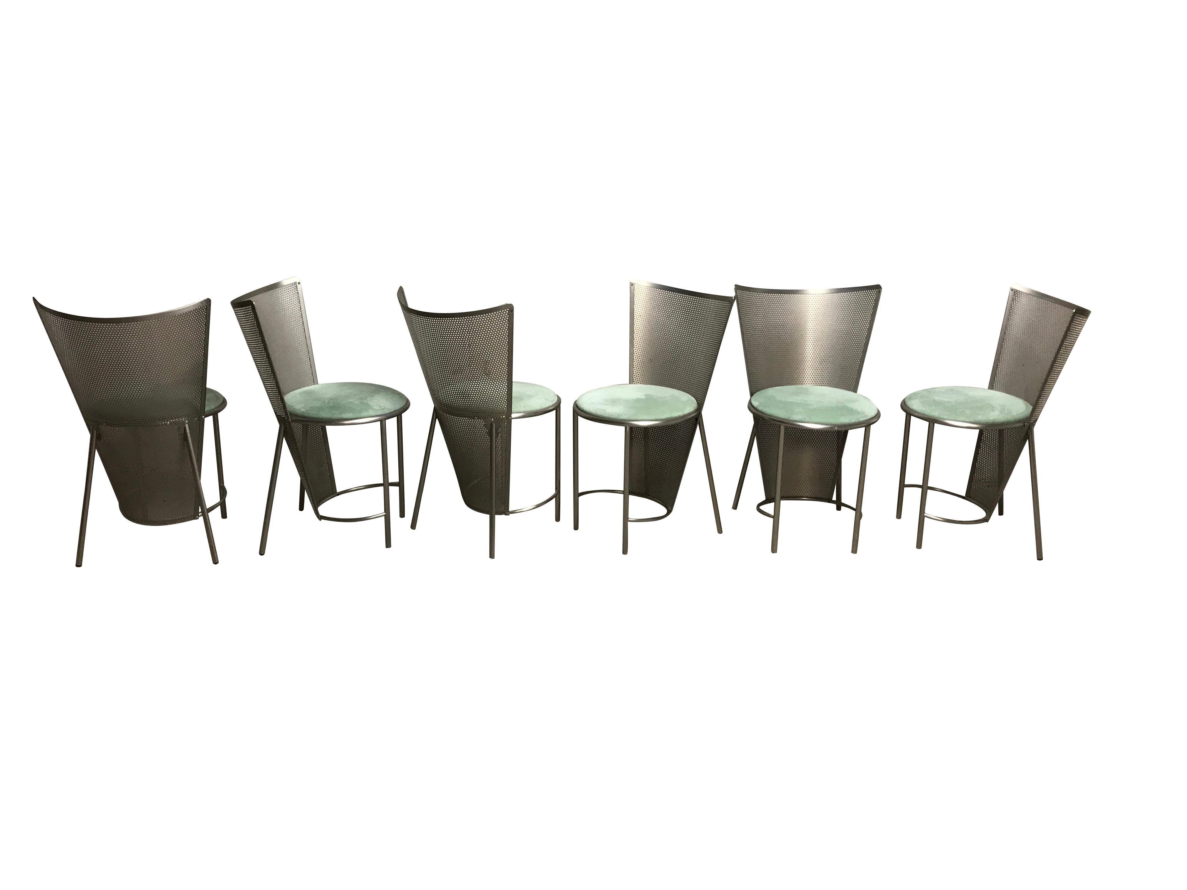Set of six perforated metal dining chairs designed by Frans Van Praet for belgochrom.

These chairs where designed for the world expo of 1992 in Sevilla.

The chairs have a beautiful geometric design and the seats have new green alcantara