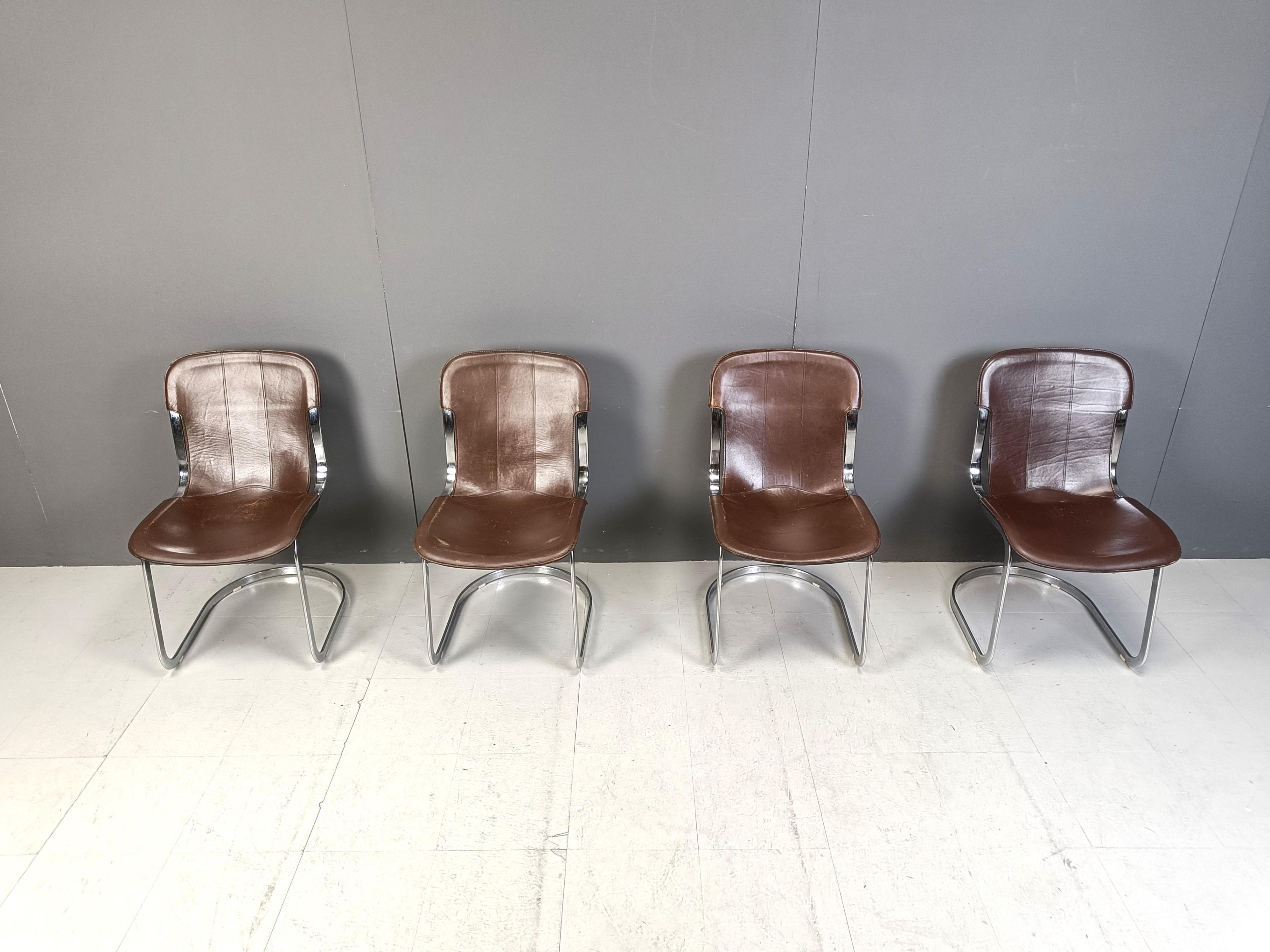 Set of 4 dining chairs designed by Willy Rizzo for Cidue.

The chairs have a beautifully shaped chrome frame and come with the original brown leather seats.

Good vintage condition

The chairs still look up to date in modern day interiors and seat