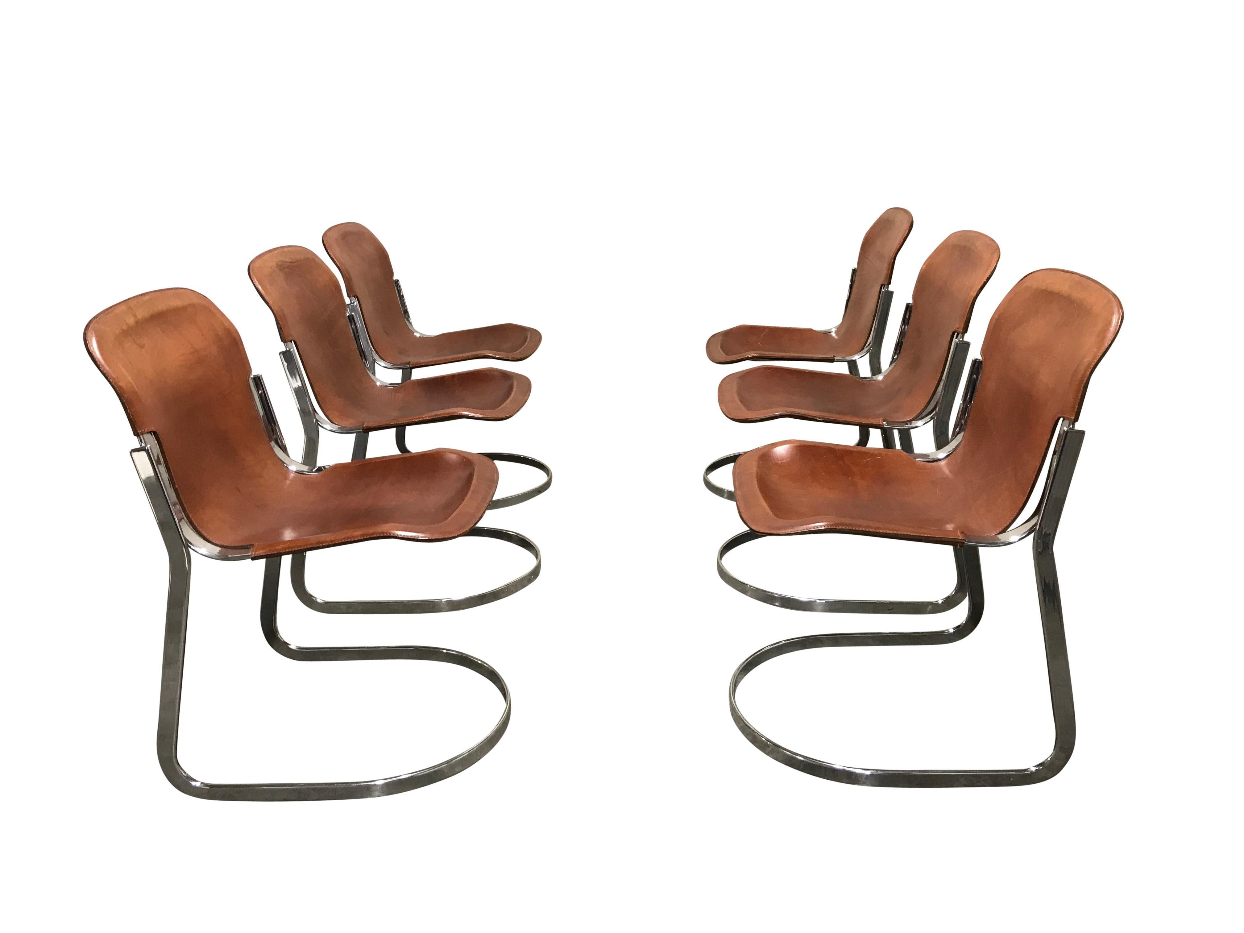 Set of 6 dining chairs designed by Willy Rizzo for Cidue (model C2).

The chairs have a beautifully shaped chrome frame and come with the original brown leather seats.

The chairs are stackable.

Very good condition, no discoloration, no