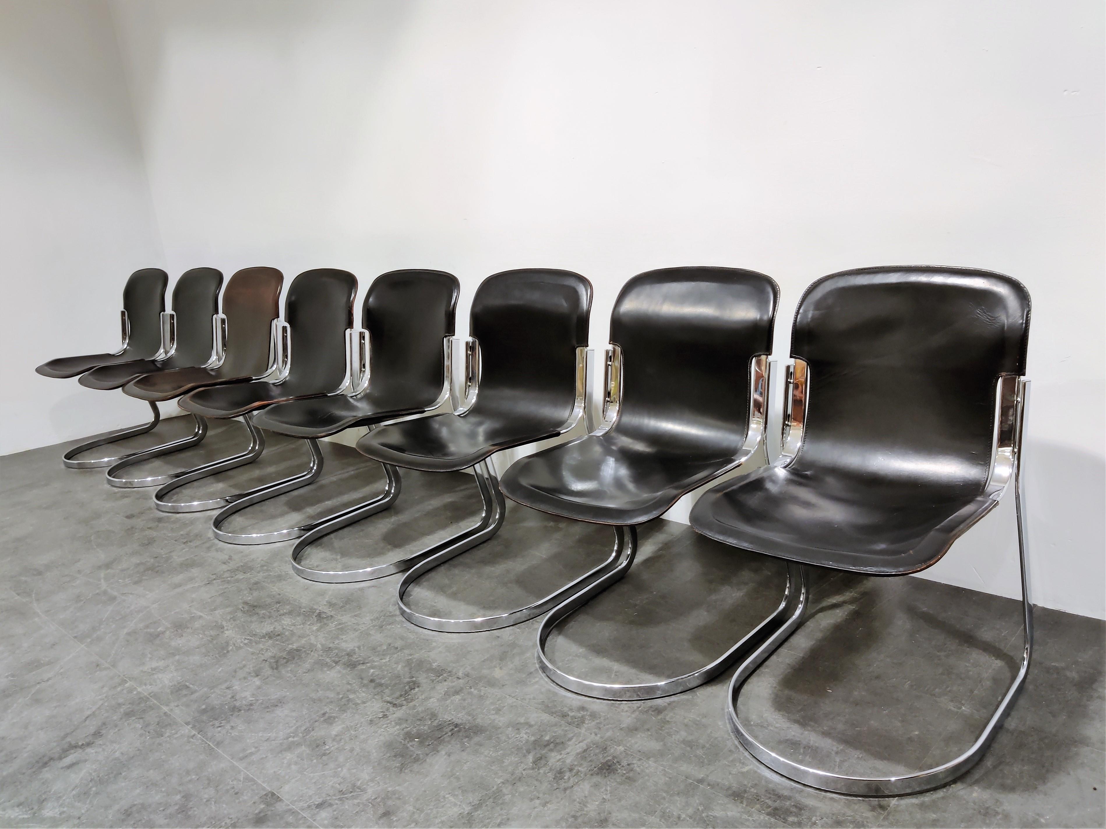 Set of 8 dining chairs designed by Willy Rizzo for Cidue (model C2).

The chairs have a beautfiully shaped chrome frame and come with the original black leather seats.

The chairs are stackable.

Very good condition, no discoloration, no