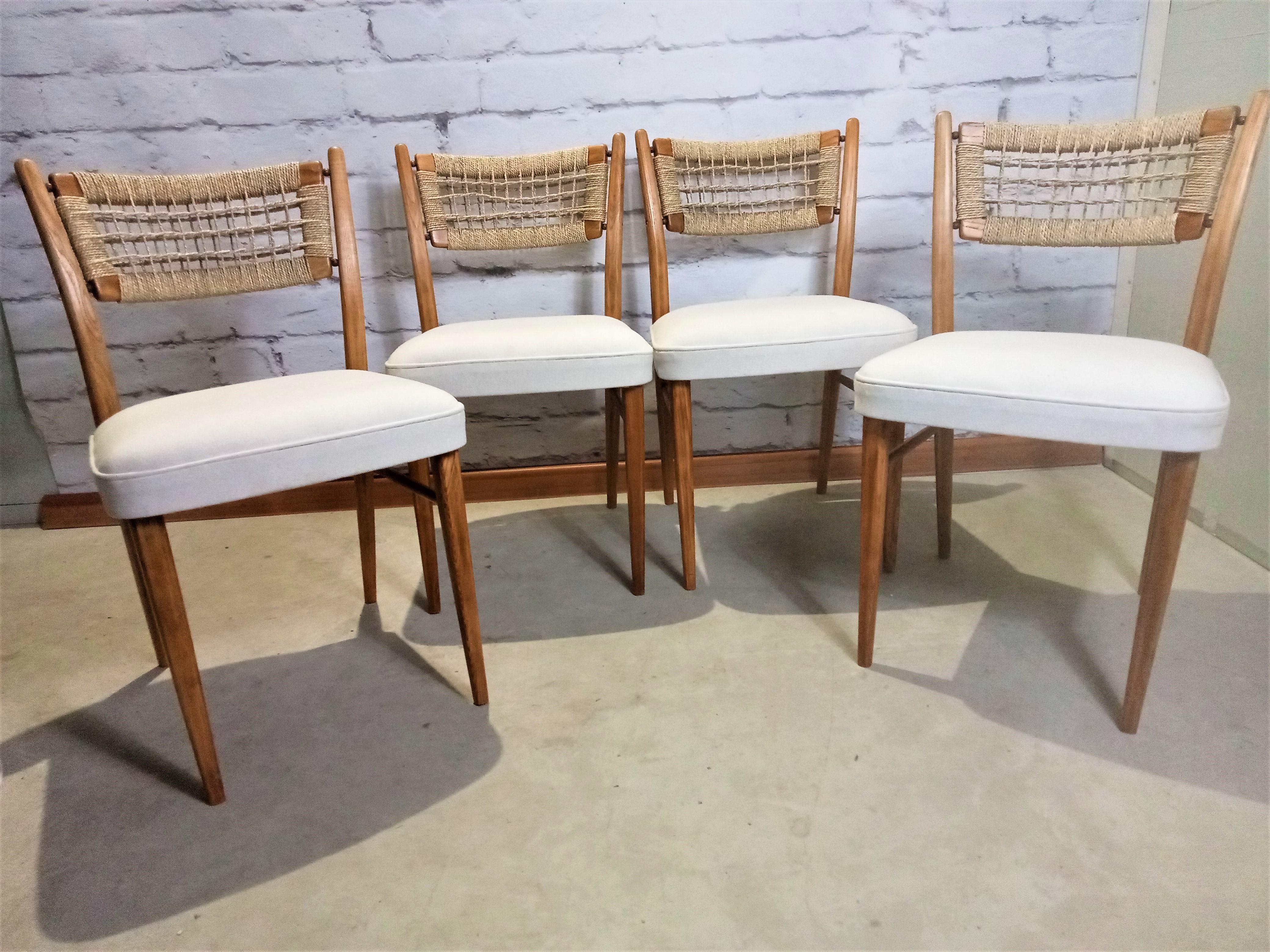 Set of 4 chairs with backs made of papercord. Light, elegant dining chairs. Maple wood frame, seats reupholstered with woolen fabric. Rarely seen, they will be an eye catcher in the dining room.