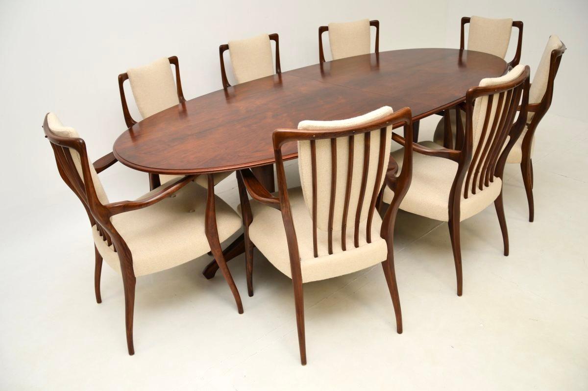 Une magnifique et très rare table et chaises de salle à manger vintage par Andrew Milne pour Heal's. Il a été fabriqué en Angleterre et date du début des années 1950.

Il s'agit de l'apogée du mobilier britannique du milieu du XXe siècle. Ce modèle