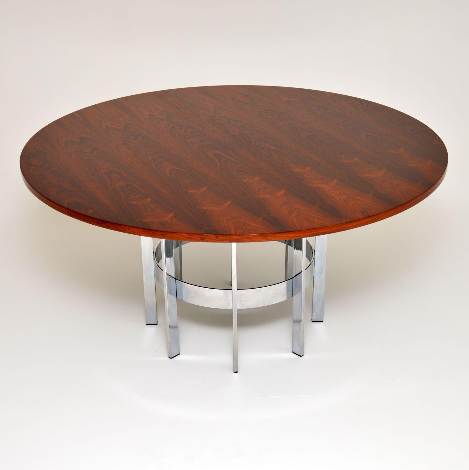A beautiful and rare vintage dining table by Merrow Associates. It was designed by Richard Young, it was made in England and it dates from the 1960-70’s.

The large circular top sits on a gorgeous spoked chrome base. This can seat six comfortably