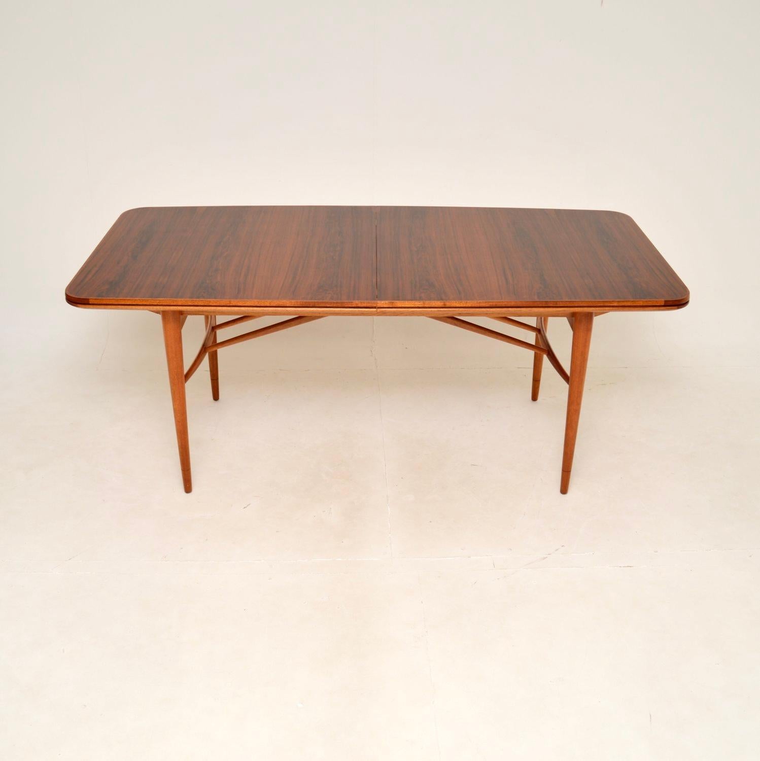 A fantastic vintage dining table by Robert Heritage for Archie Shine. This is the ‘Hamilton’ dining table, made in England and dates from the 1960’s.

This is of superb quality, with a beautiful top and solid base. The colour tone and grain patterns