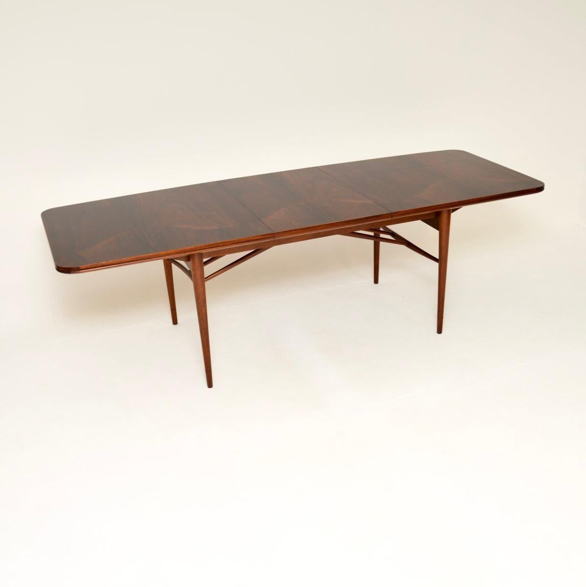 A stunning vintage dining table by Robert Heritage for Archie Shine. This is the ‘Hamilton’ dining table, made in England and dates from the 1960’s.

This is of outstanding quality, with a beautiful top and a solid base. The colour tone and grain