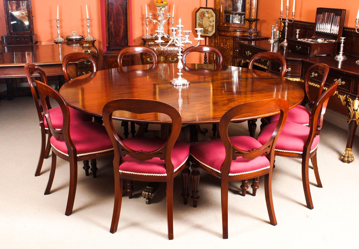 This is a fabulous dining set comprising a very large Vintage Regency style dining table by William Tillman, bought from Harrods, Knightsbridge, London and a set of ten mahogany ballon back dining chairs, late 20th century in date.

The table top