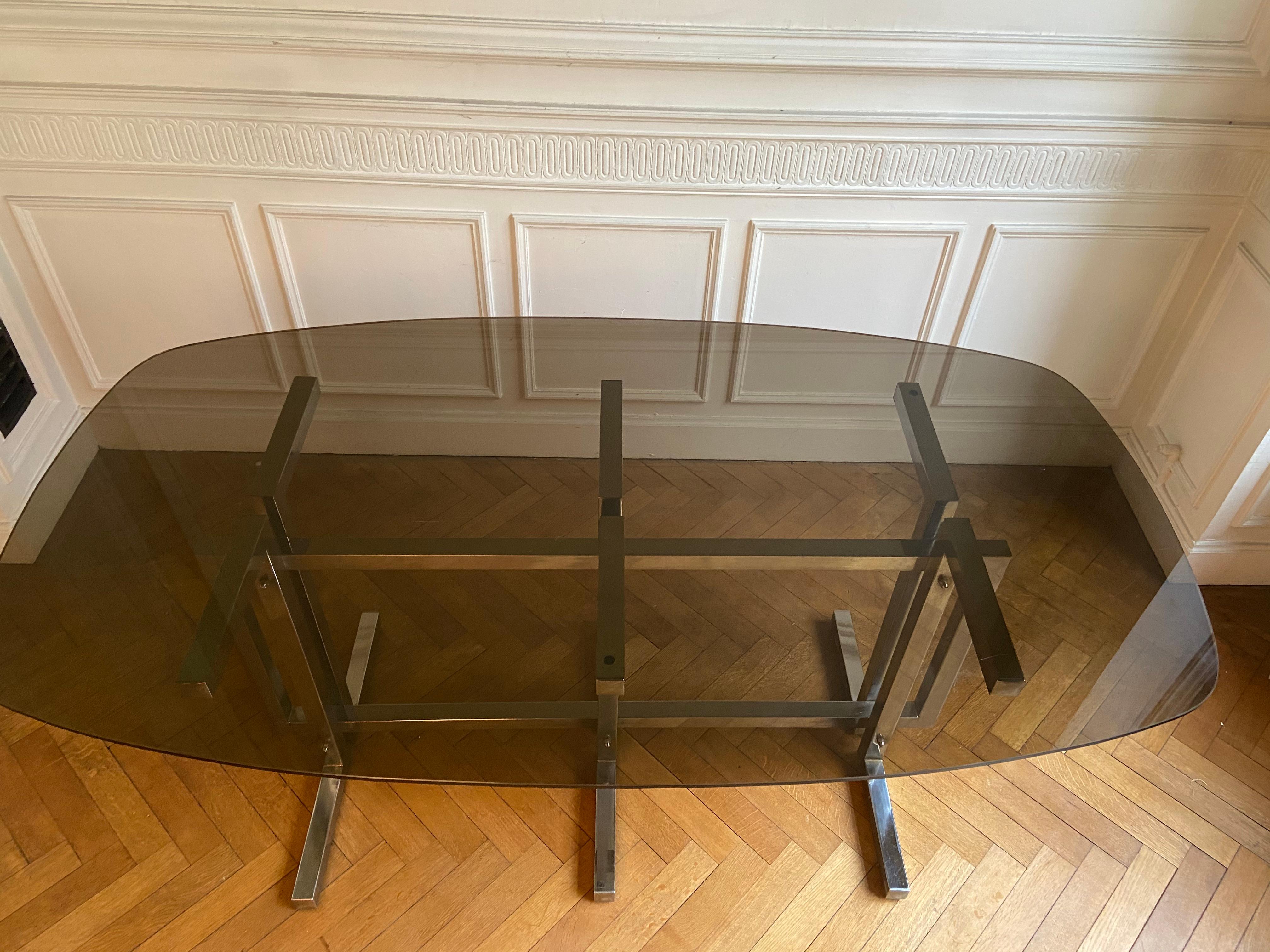 Vintage dining table. Graphic feet in chrome metal. Smoked glass top. 2
