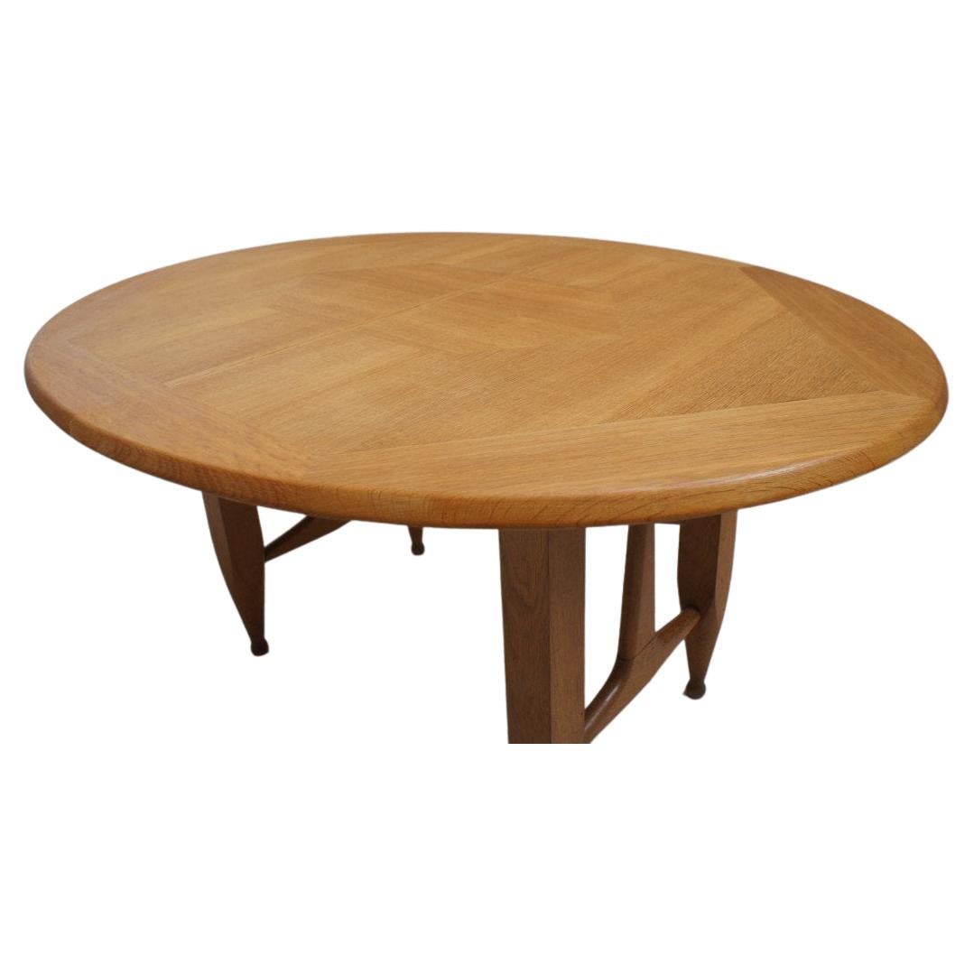 Oval dining table in light oak and oak marquetry. It has two allons, total length with it is 206cms.