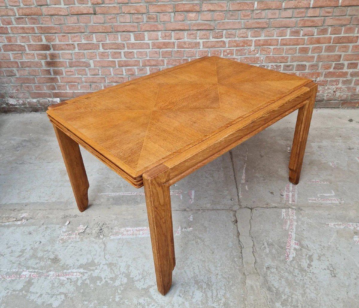 Rare dining room table in oak and oak marquetry by Guillerme and Chambron for 