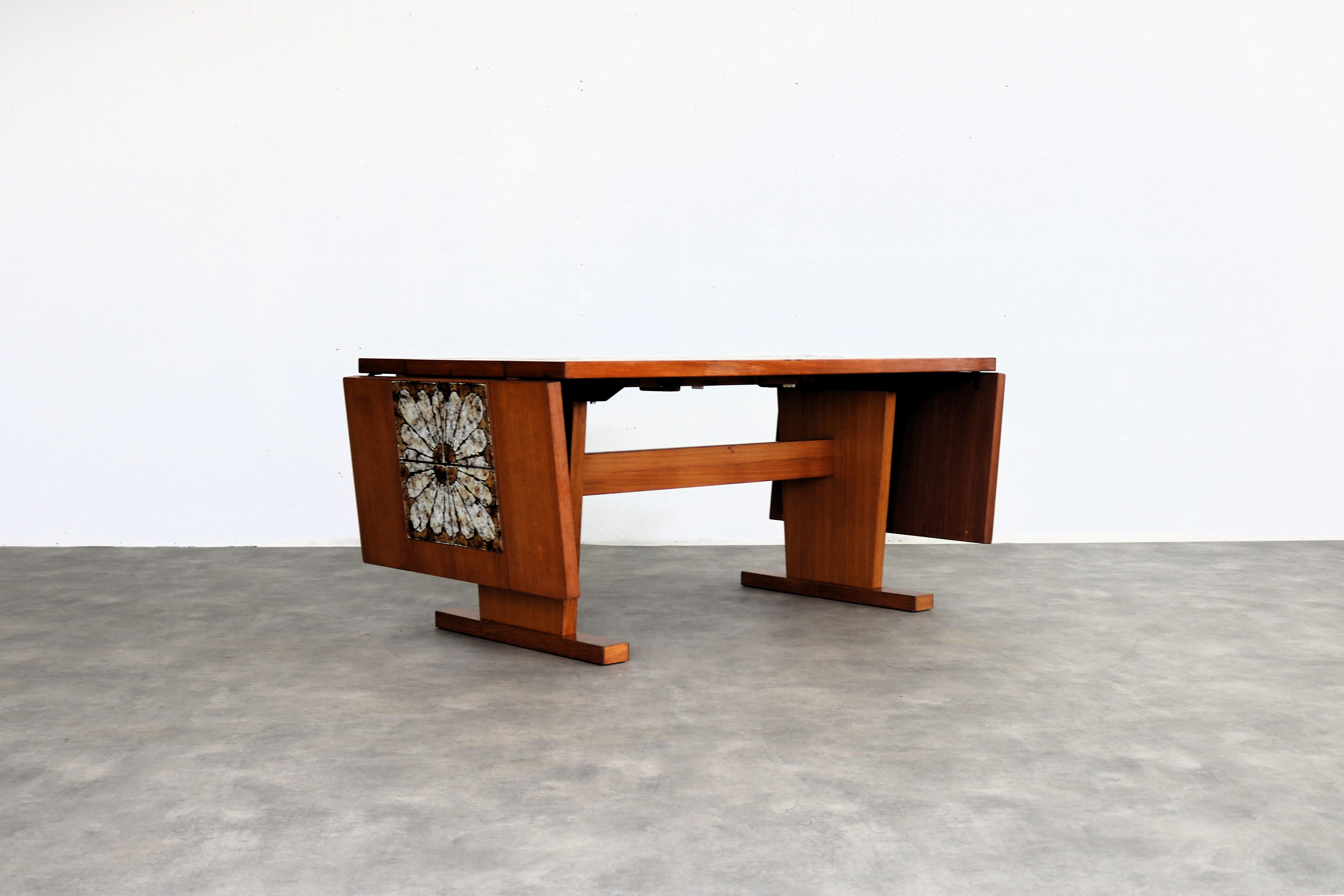 Vintage dining table  table  1960s  extendable

period  1960s
design  Gangso Mobler  Denmark
condition  good  minor signs of wear  veneer restoration
size  73 x 160 x 87 cm (H x W x D) extendable with two 50 cm leaves;

details  teak; ceramic;