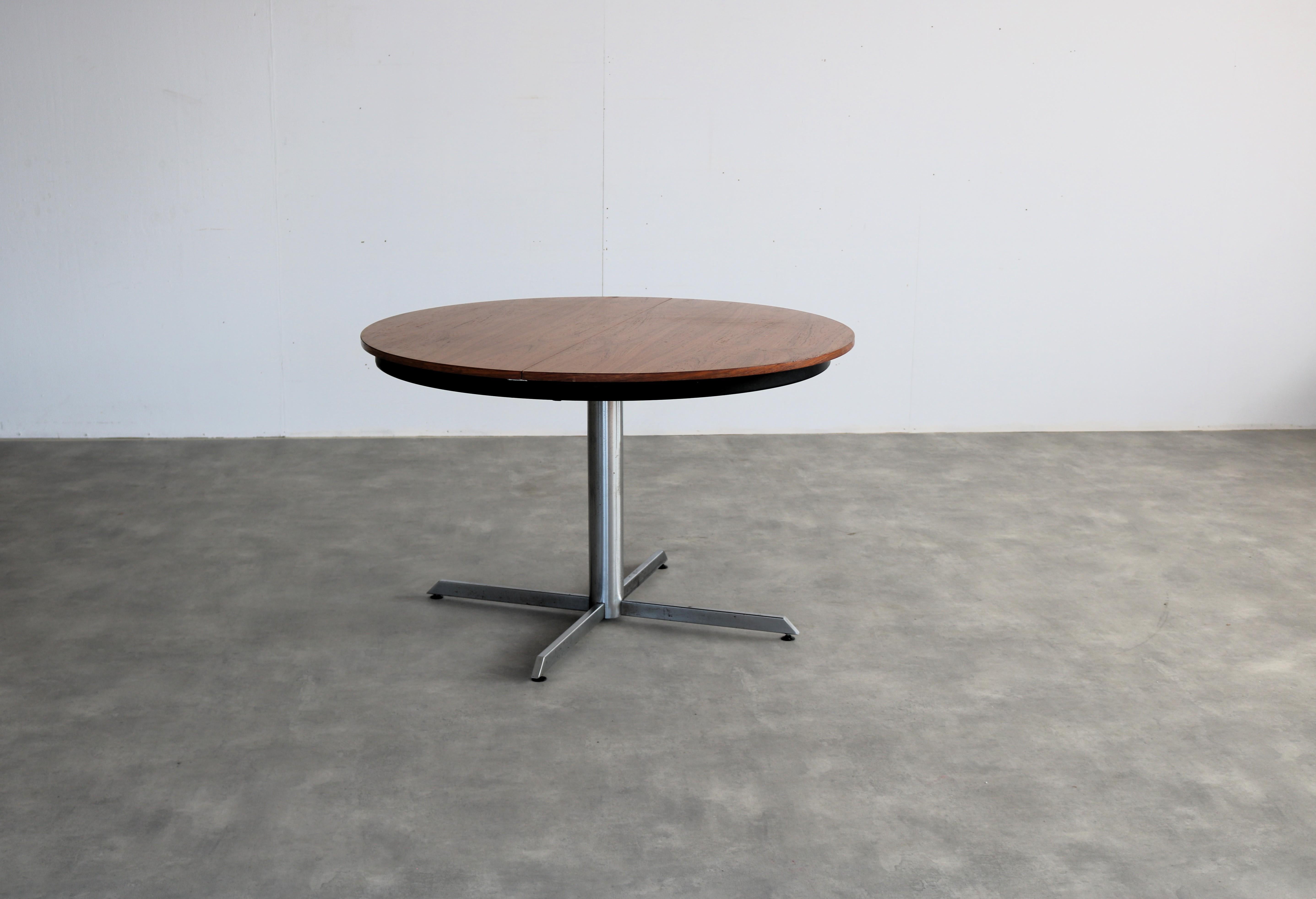 vintage dining table  table  extendable  60's

period  60's
design  unknown 
condition  good  light signs of use  rust spots
size  74.5 x 120 x 120 (hxwxd) + extra top of 50 cm; 

details  teak; chrome; metal; 

article number  2677