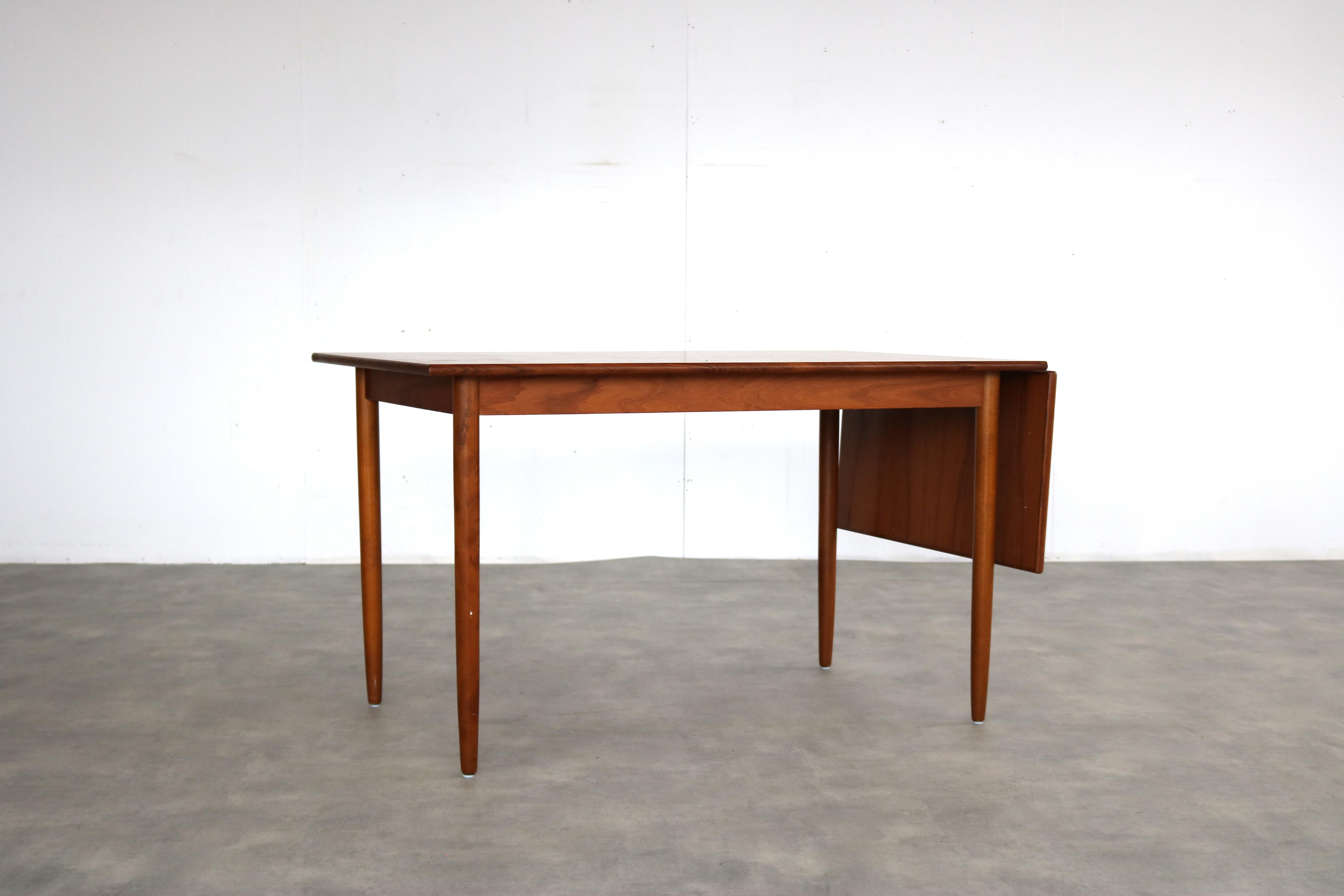 vintage dining table  table  teak  extendable  Swedish

period  60's
design  unknown  Sweden
condition  good  light signs of use
size  73 x 124 x 79 (hxwxd) + extra top of 40 cm; 

details  teak; extendable; 

article number  2404