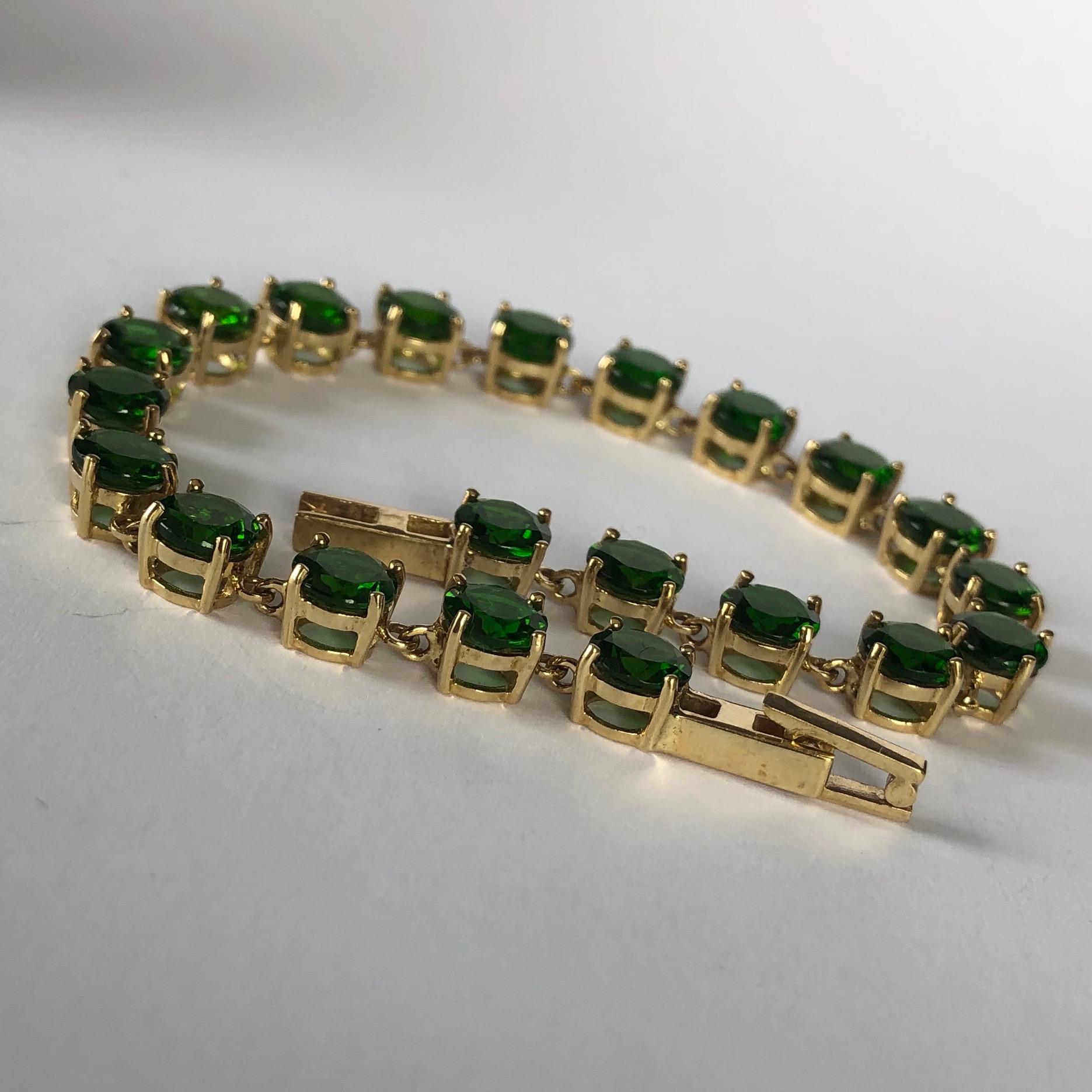 Set in this 9carat gold bracelet are 21 diopside stones which total 21ct. The stones are deep green and when the light hits the stones they have a bright green glow. 

Length: 19.7cm
Width: 6mm

Weight: 12.7g
