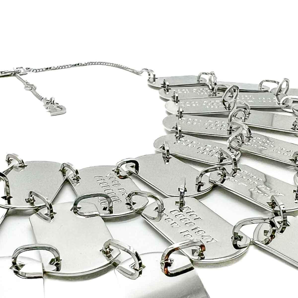 An iconic and grandiose Vintage Dior Logo Bib Necklace from the House during the John Galliano era when drama was everything and reinvention of the codes of the house achieved new heights. Crafted in rhodium plated metal. Featuring a huge bib style