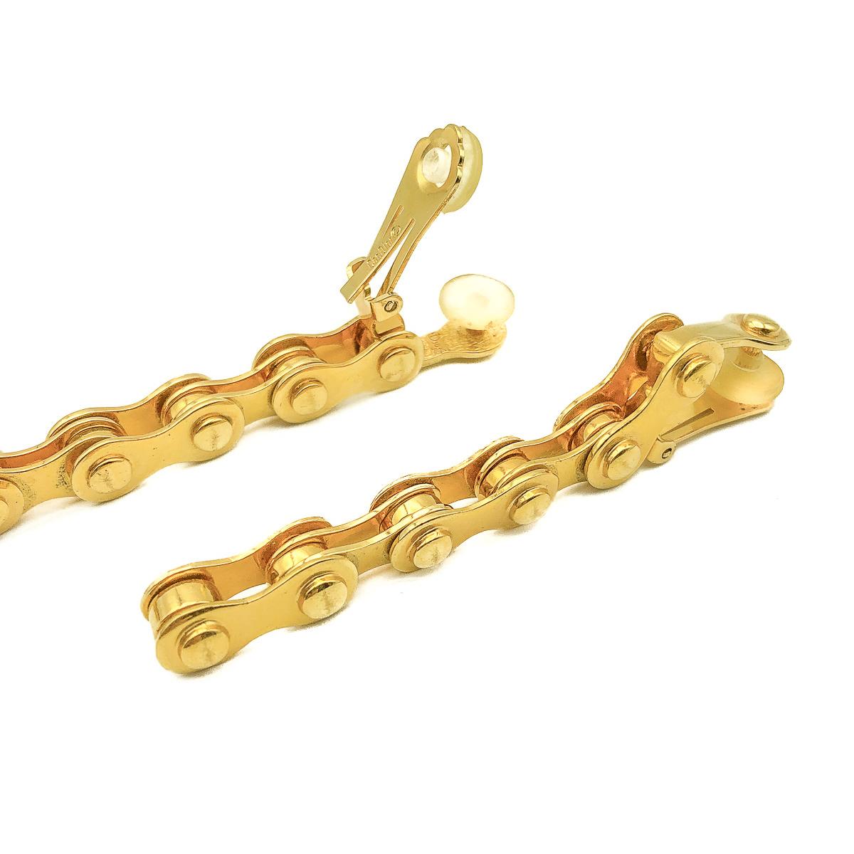 A legendary piece of Dior by Galliano. Our Galliano Bike Chain Earrings. Crafted in gold plated metal. Created for the much adored Fall 2000 collection. Featuring a long drop in a articulated bike chain style. In very good vintage condition. Signed.