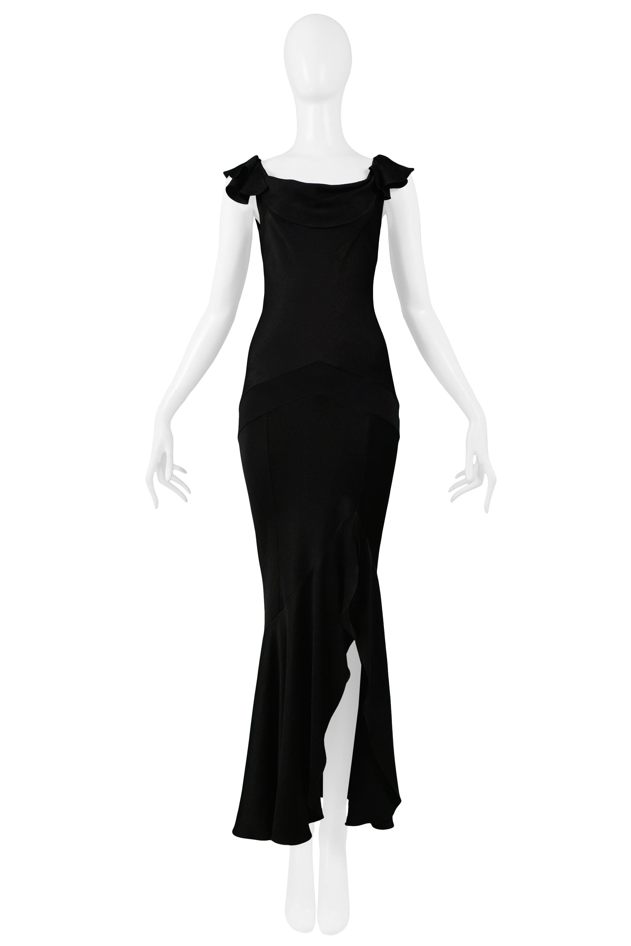 Resurrection Vintage is excited to offer a vintage Christian Dior by John Galliano black bias cut evening gown with draped neckline, flutter sleeves, inset panel detail, and side slit with ruffled hem.

Christian Dior Paris
Designed by John