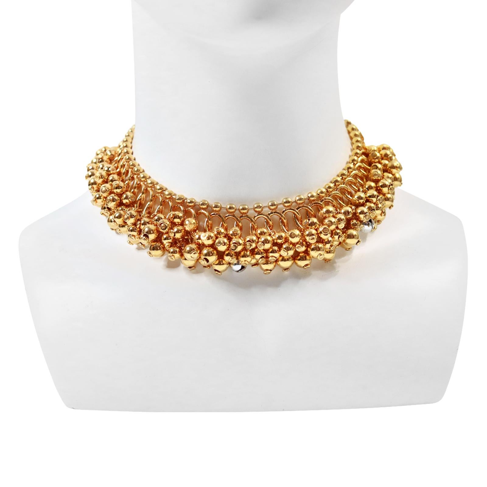 Vintage Dior Gold Choker Necklace with Dangling Balls Circa 2000.  This necklace is so chic.  All gold balls dangle except for three silver bells.  I promise there is no sound but you know they are there so it makes it special. Dior never does