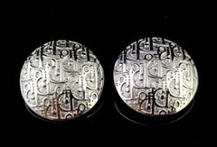 Vintage Dior logo script clip on earrings, silver tone metal