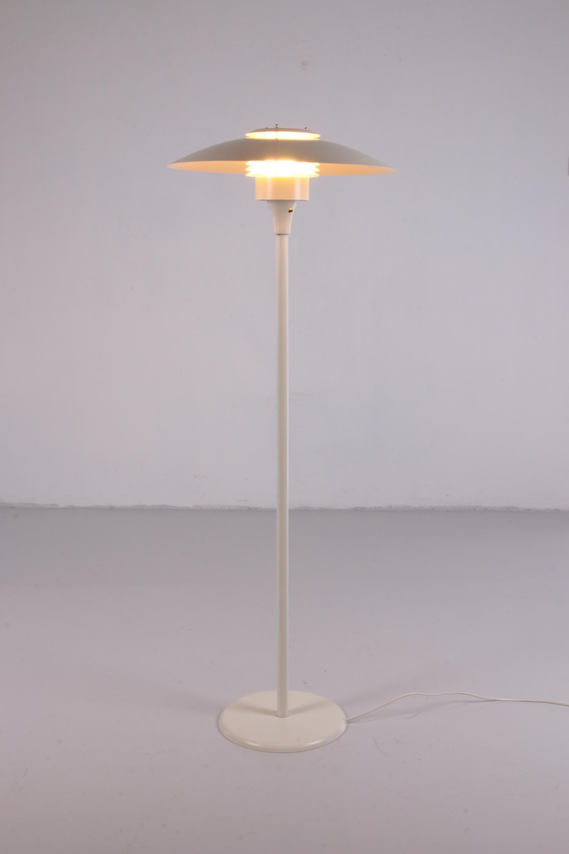 Vintage disks floor lamp produced by Lyfa Denmark. The lamp is in excellent condition and is marked. Switch is located under the disks.

This charming Scandinavian floor lamp was produced by Lyfa Denmark in the 1960s. It consists of a metal housing