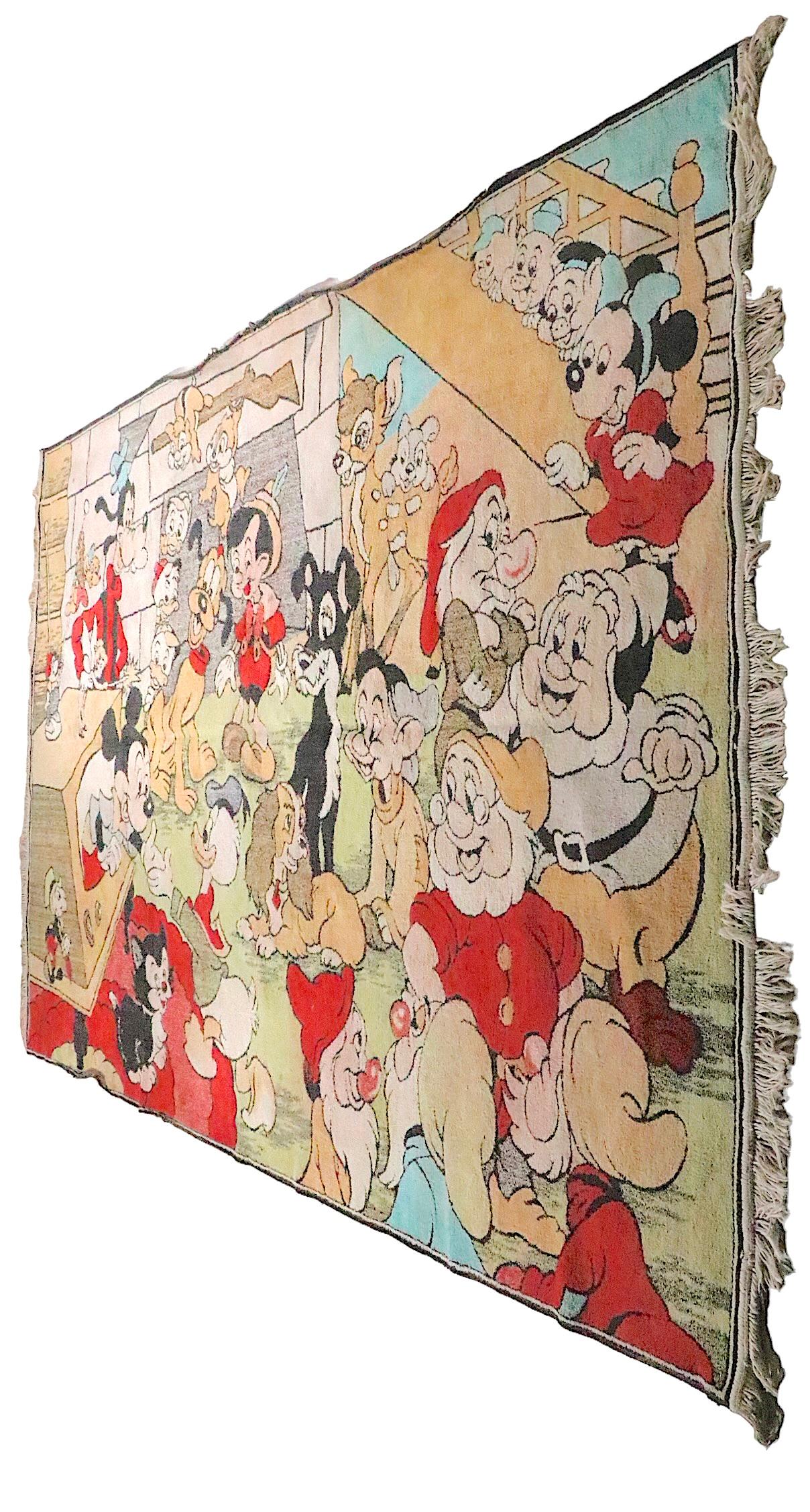 Vintage 1960's  Disney themed rug, sometimes referred to as a Play Pen Rug, we believe it is a Quetta product made in Pakistan. The rug features a virtual who's who of Disney characters, Mickey, Donald, Goofy, Snow White and the Seven Dwarfs etc