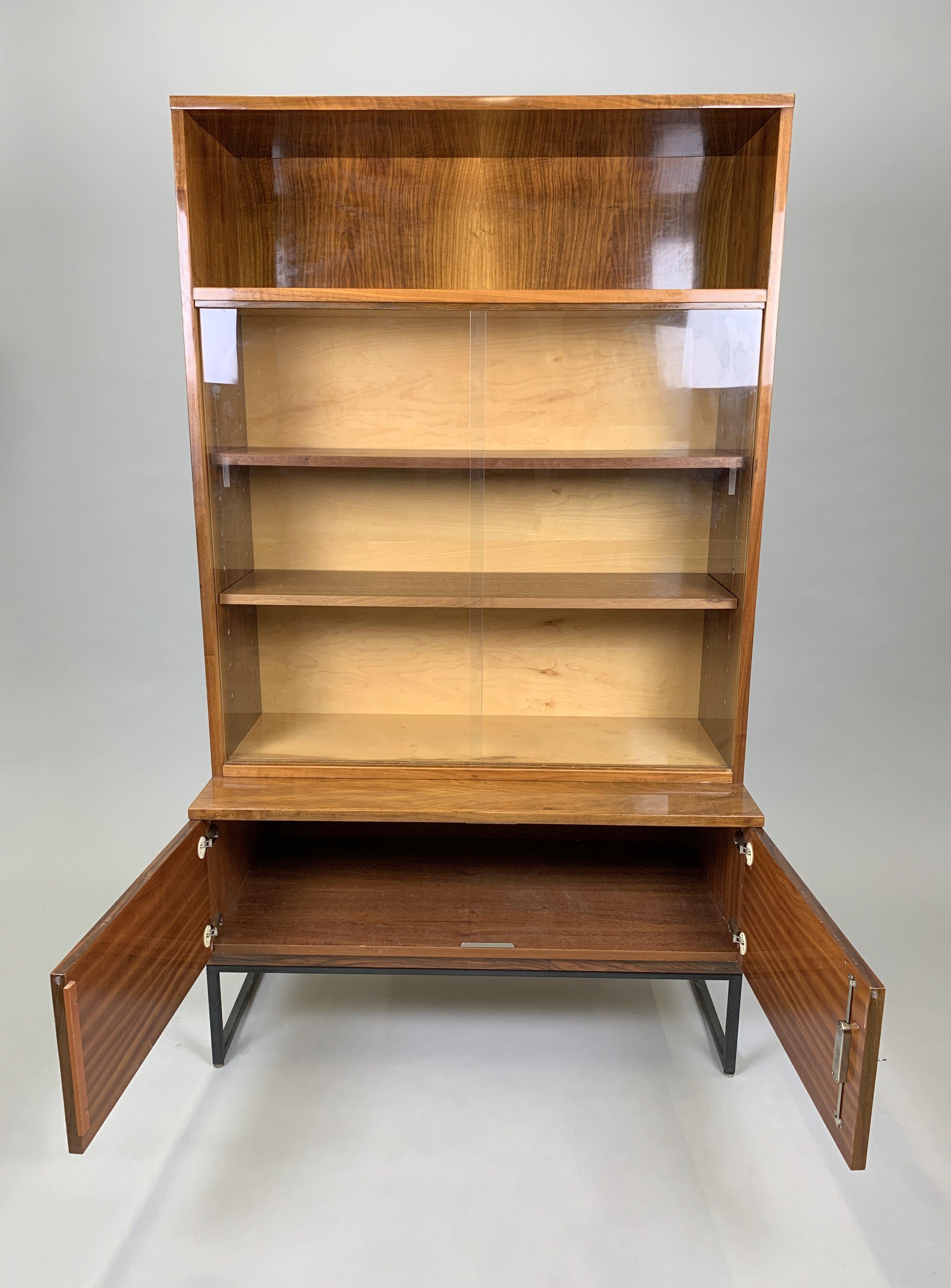 Vintage cabinet or bookcase with shelves, glass sliding doors and four drawers from 'Belmondo' collection made in high gloss. Made in Czechoslovakia by Novy Domov (marked) in the 1970s. Good original condition.