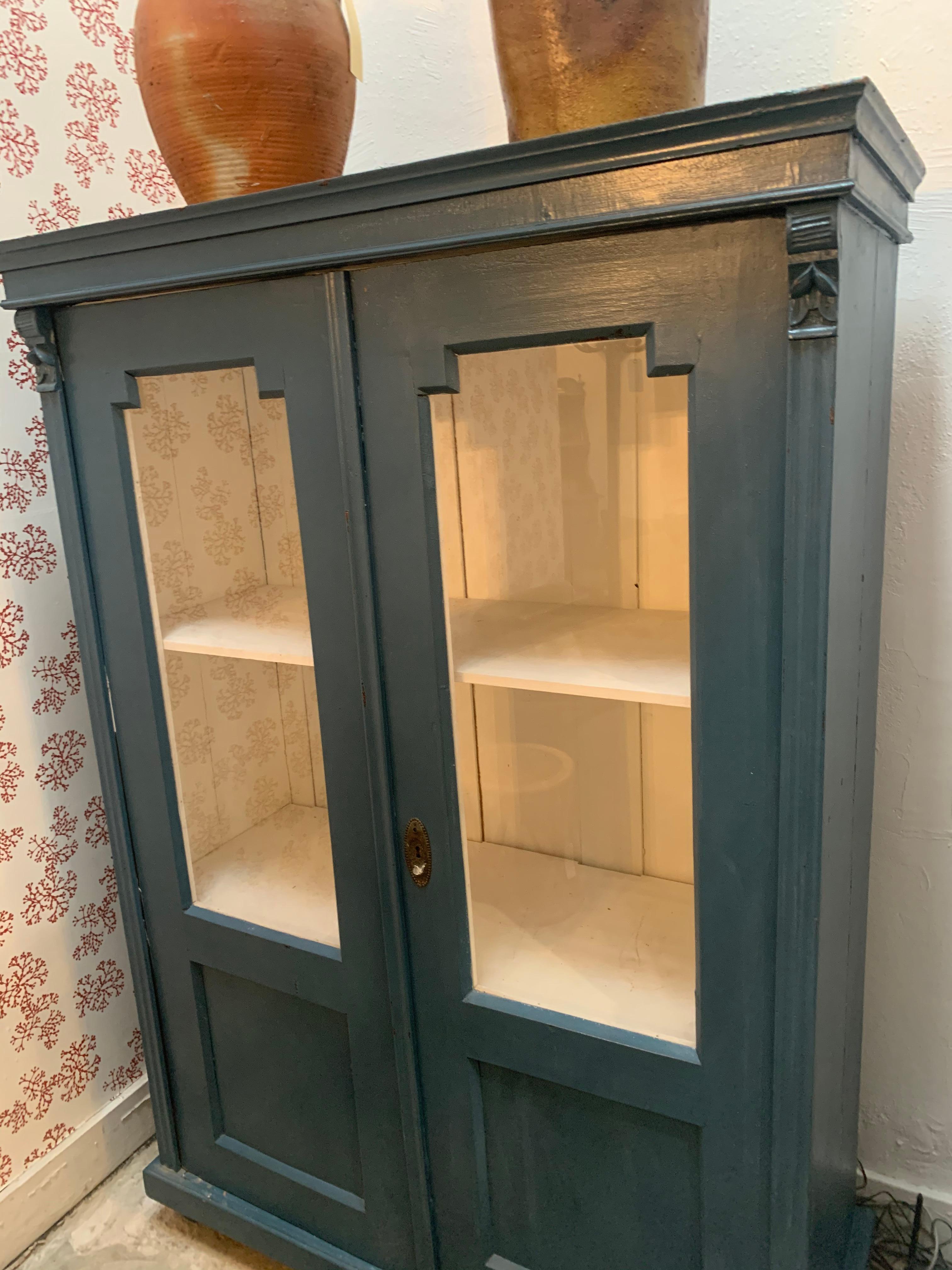 antique cabinet with glass doors