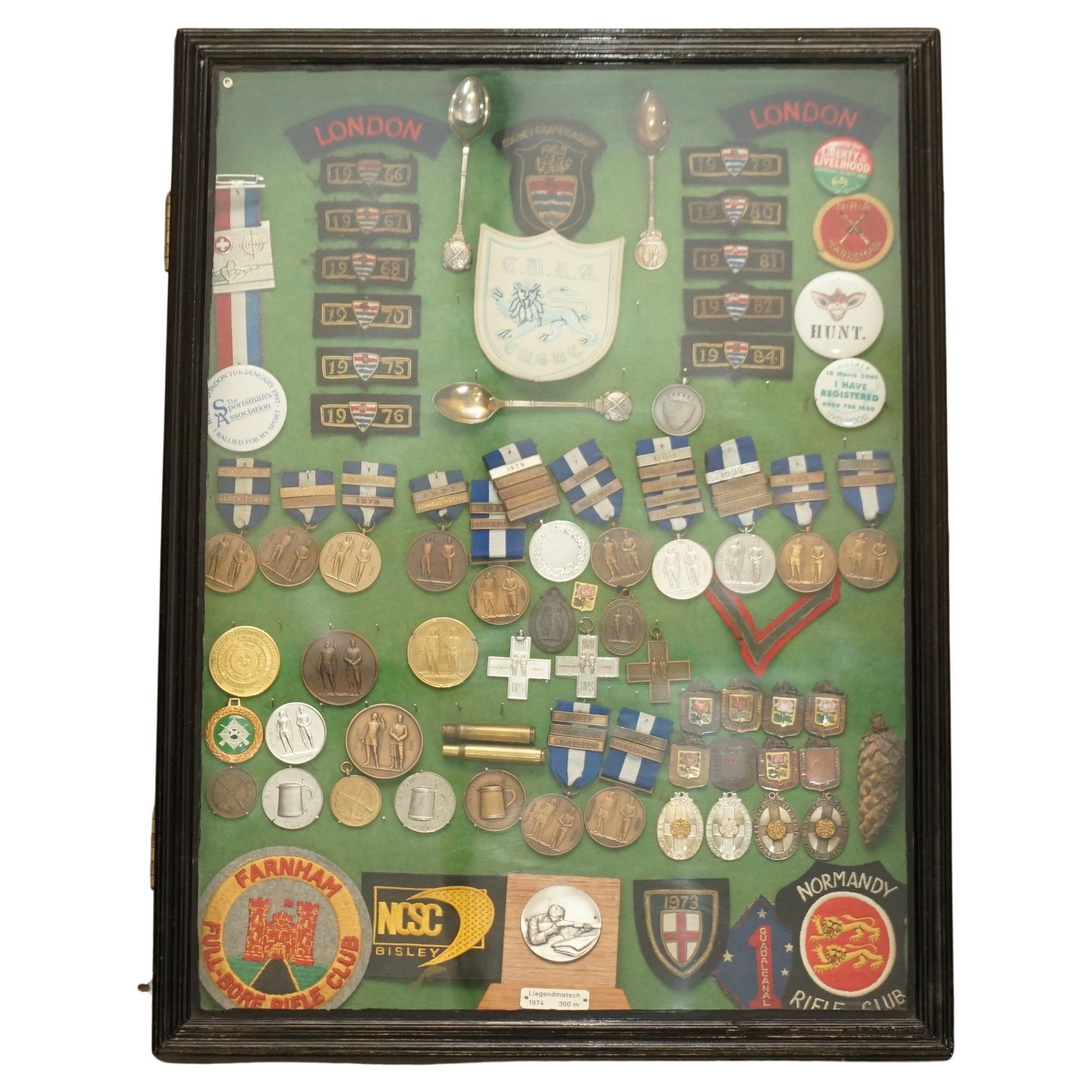 VINTAGE DISPLAY CASE FULL OF SHOOTiNG SNIPER MEDALS AND AWARDS MUST SEE PIECE