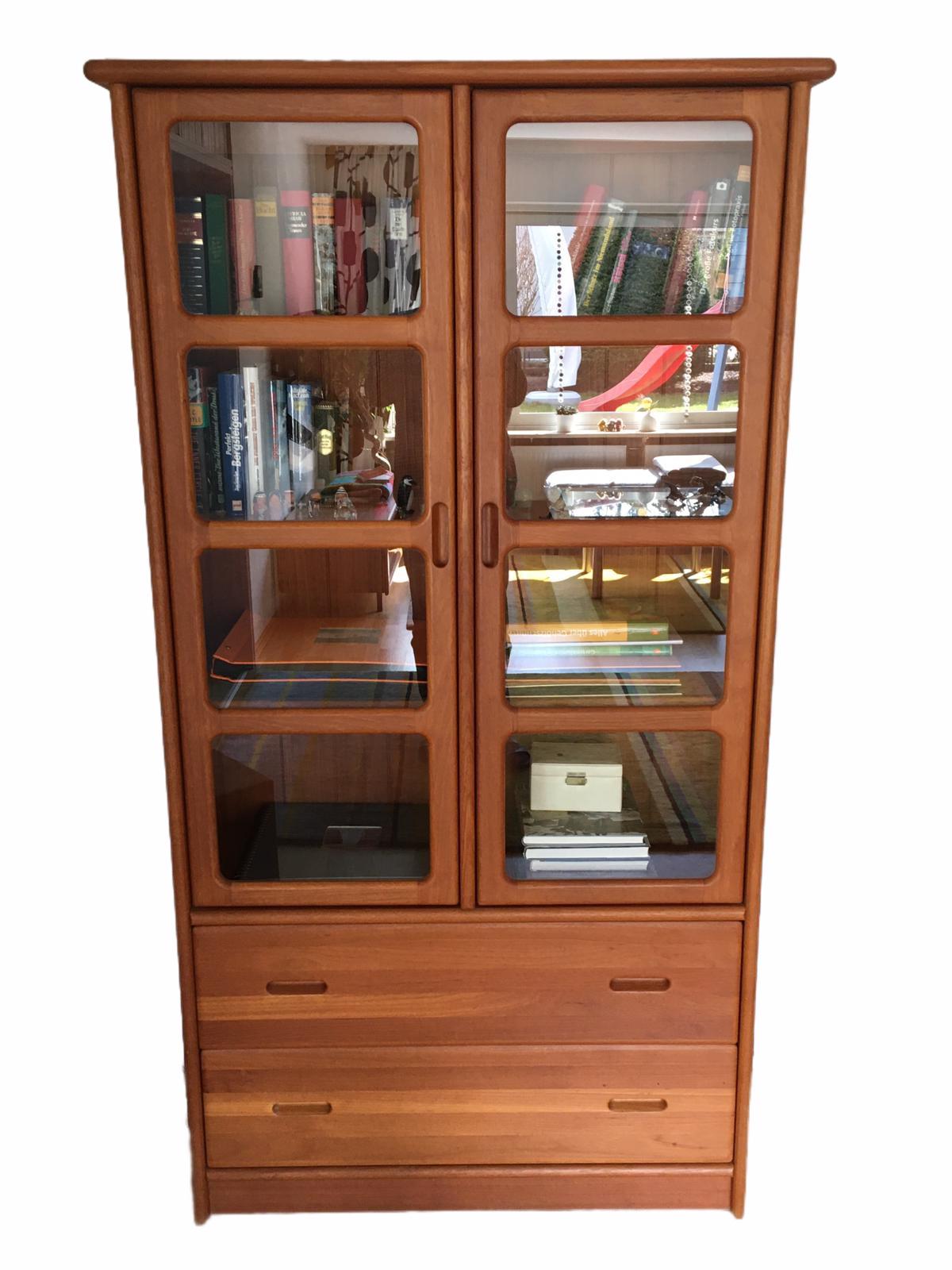 Mid century display/china cabinet, with lights, designed and manufactured by Dyrlund of Denmark. Produced in beautifully grained Teak this piece is another classic example of Dyrlund's Craftsmanship. The sheer quality of the finish is why they were