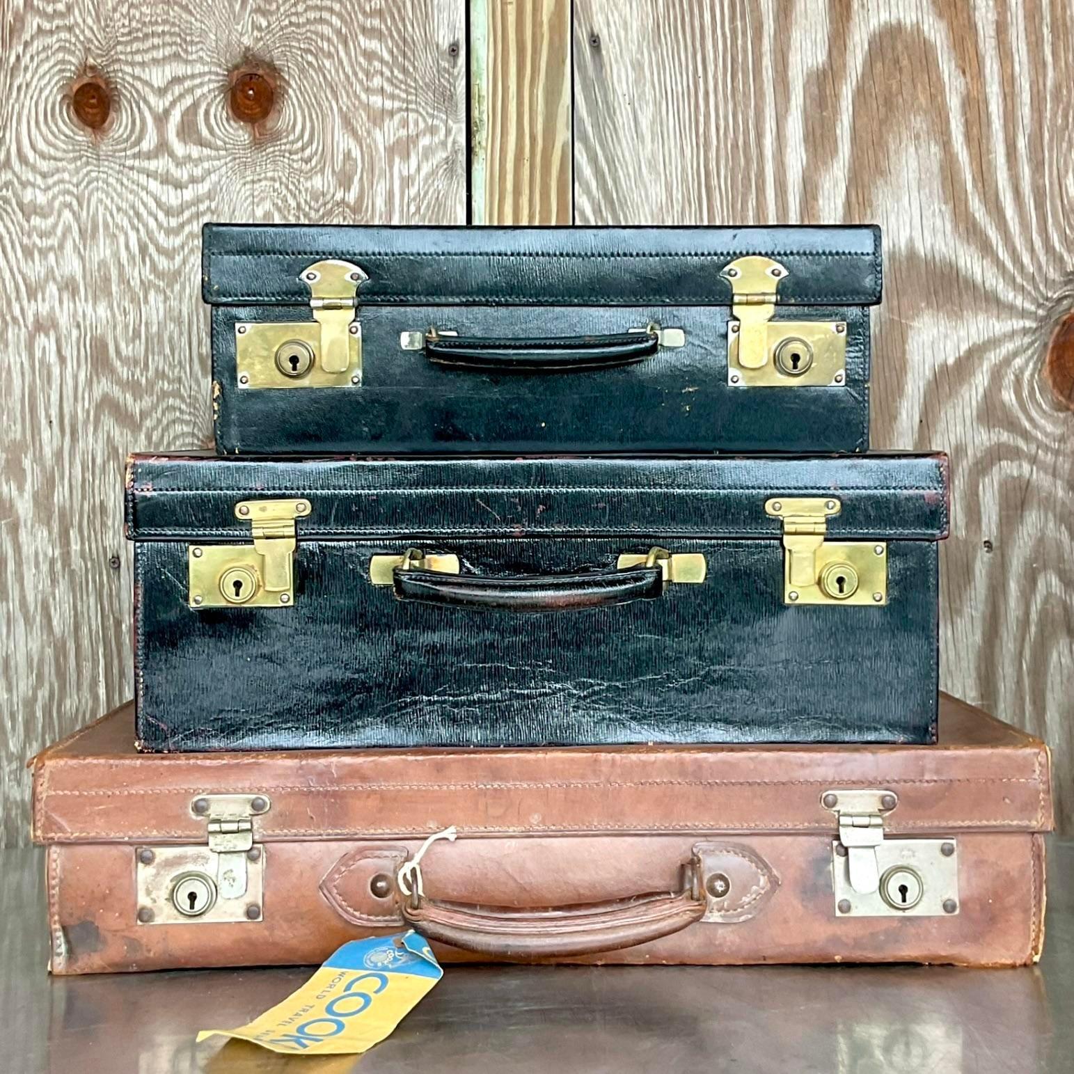 An incredible stack of chic vintage luggage. A beautiful set of three bags from a time gone by. Complete with vintage luggage tag. Perfect on top of your armoire, etagere or in your gentlemen’s dressing room. You decide! Acquired from a Palm Beach