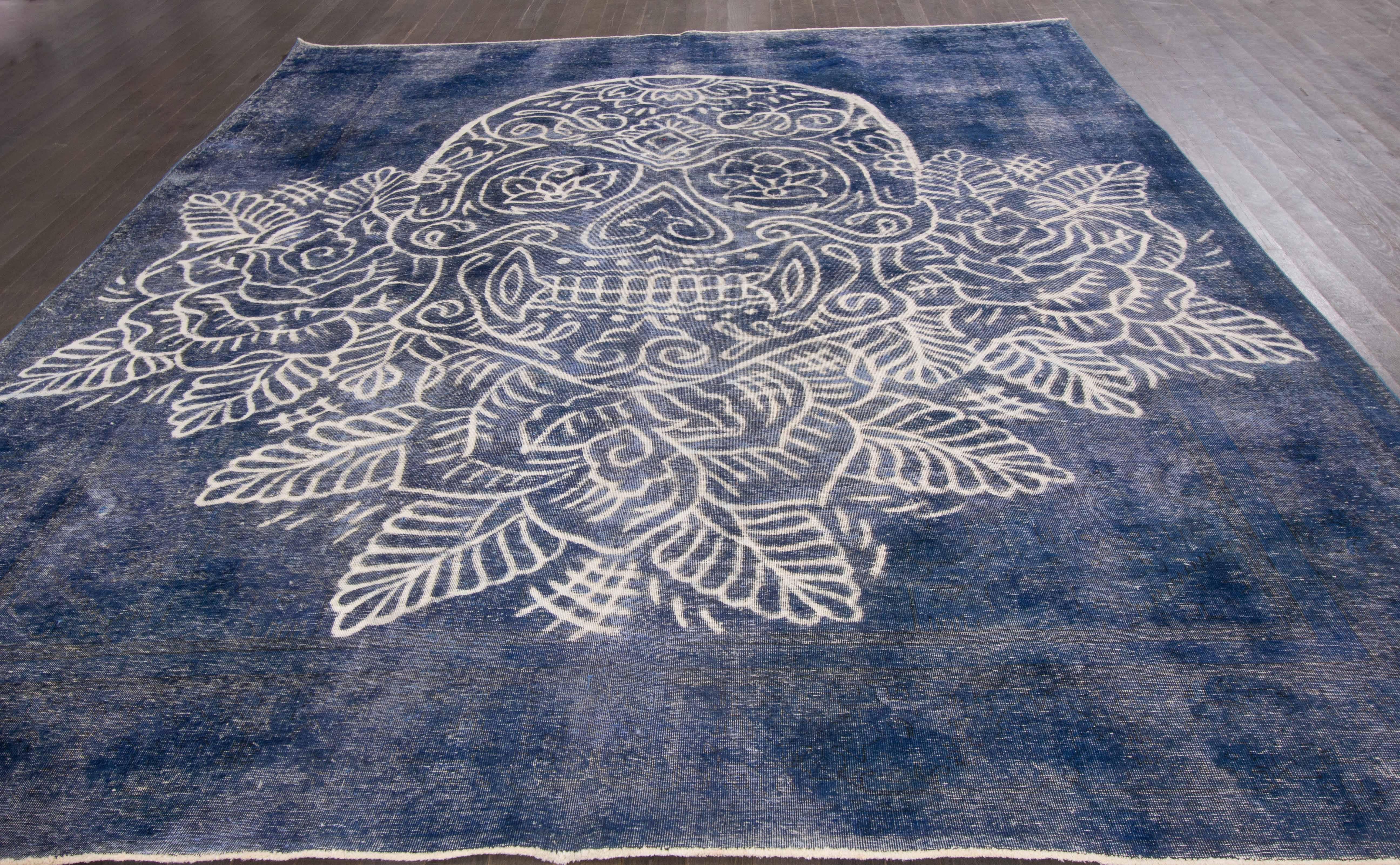 Vintage Persian hand-knotted overdyed rug with a skull motif. This piece has great detailing and a beautiful design. Measures: 12'4