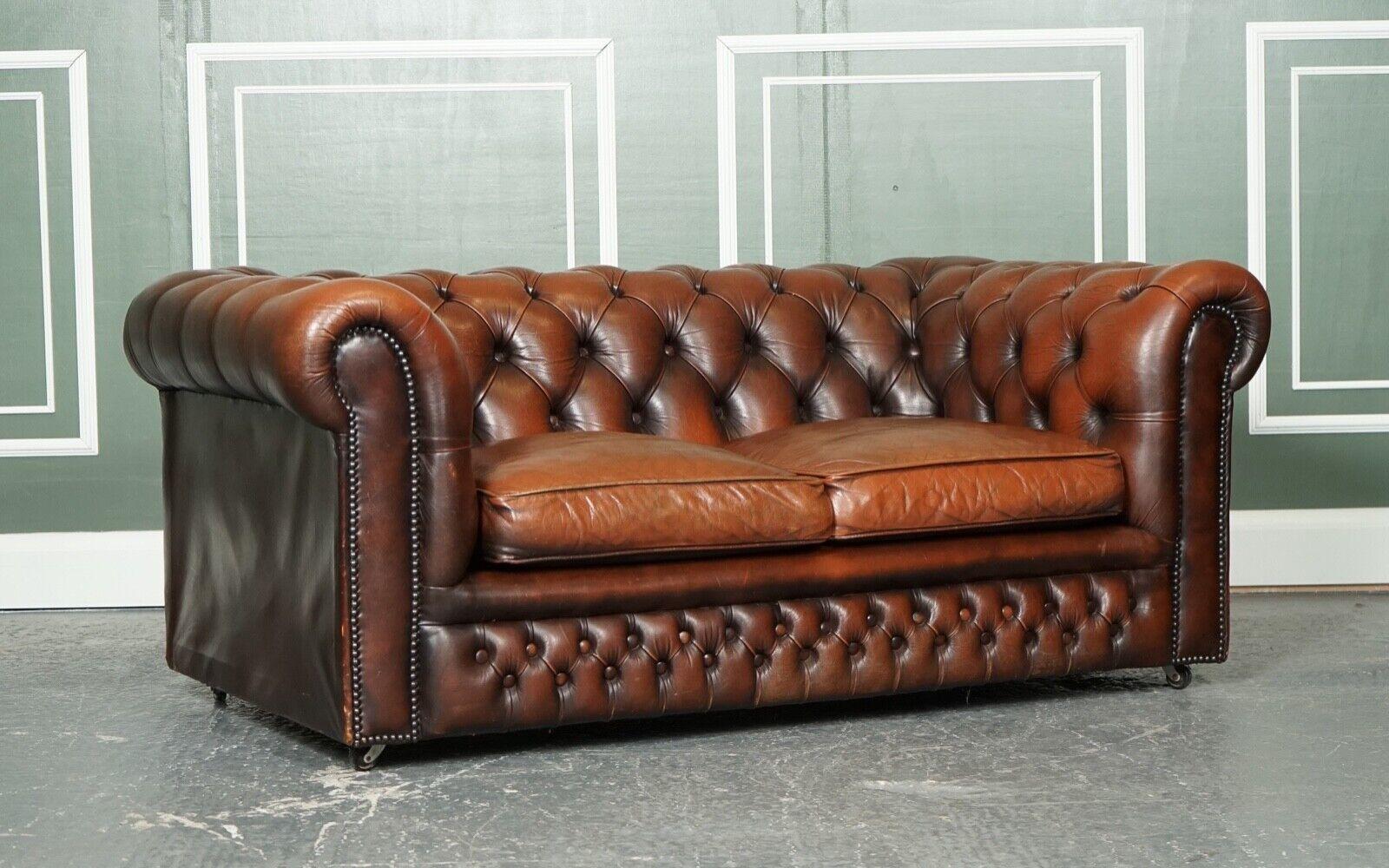 We are so excited to present to you this lovely vintage distressed brown leather chesterfield sofa.

Very good looking sofa, it can sit two to three people.

The sofa is raised on four castors which makes it easy to move if needed.

As