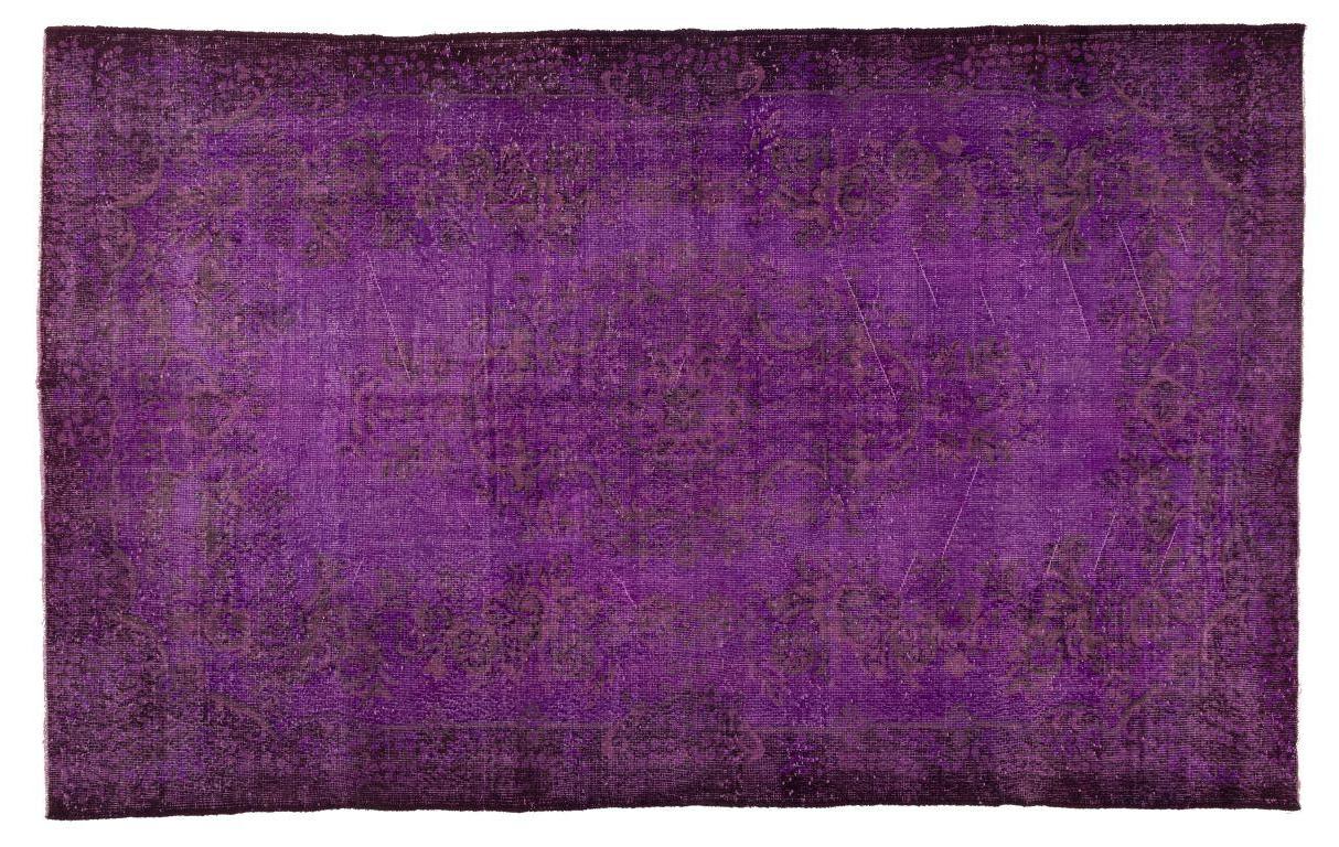A vintage handmade Turkish area rug over-dyed in purple with a floral medallion design.
It is finely hand-knotted with low wool pile on cotton foundation. It is in very good condition, professionally washed, sturdy and suitable for use in spaces