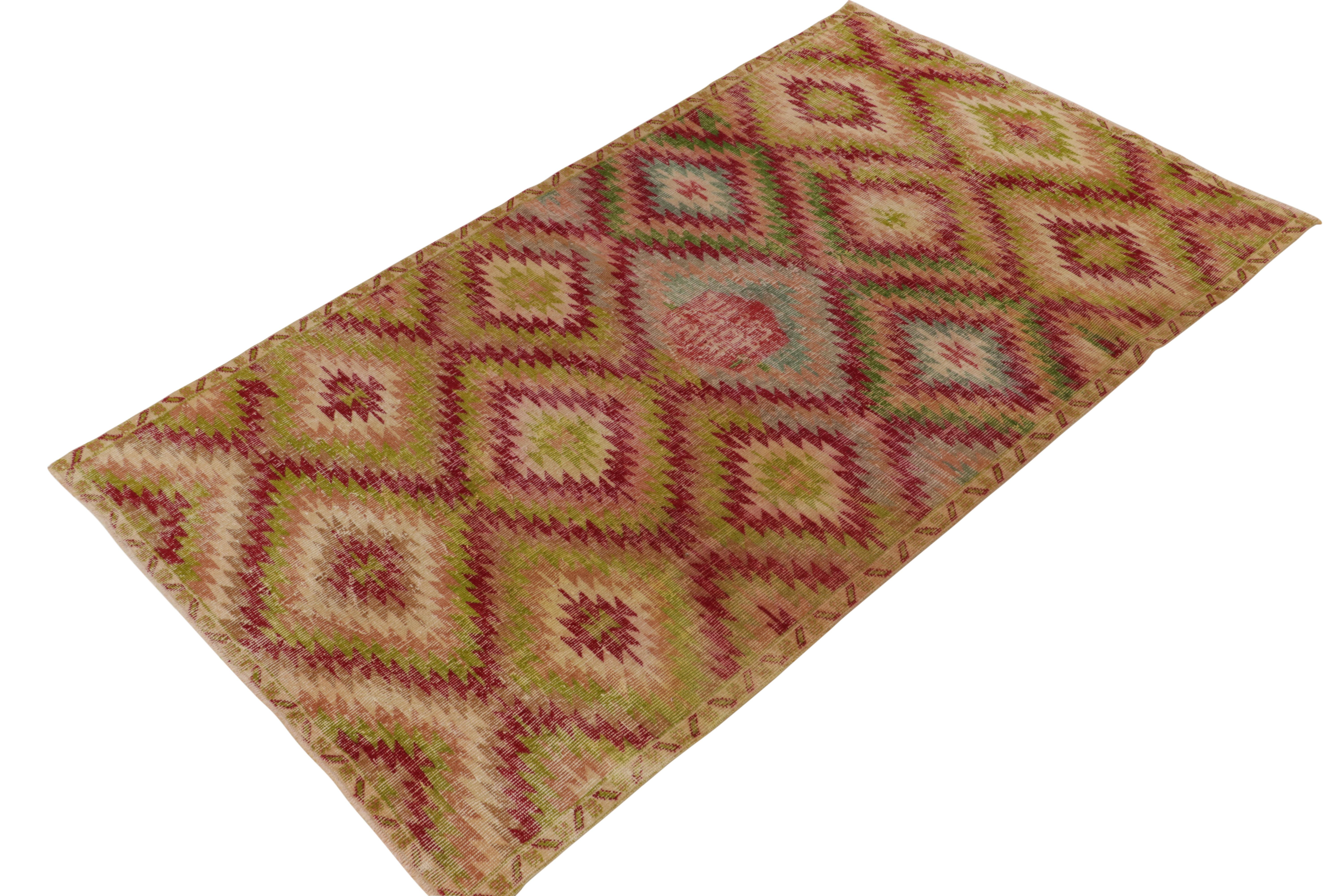 Mid-Century Modern Vintage Distressed Deco Rug in Red, Green, Pink Geometric Pattern by Rug & Kilim For Sale