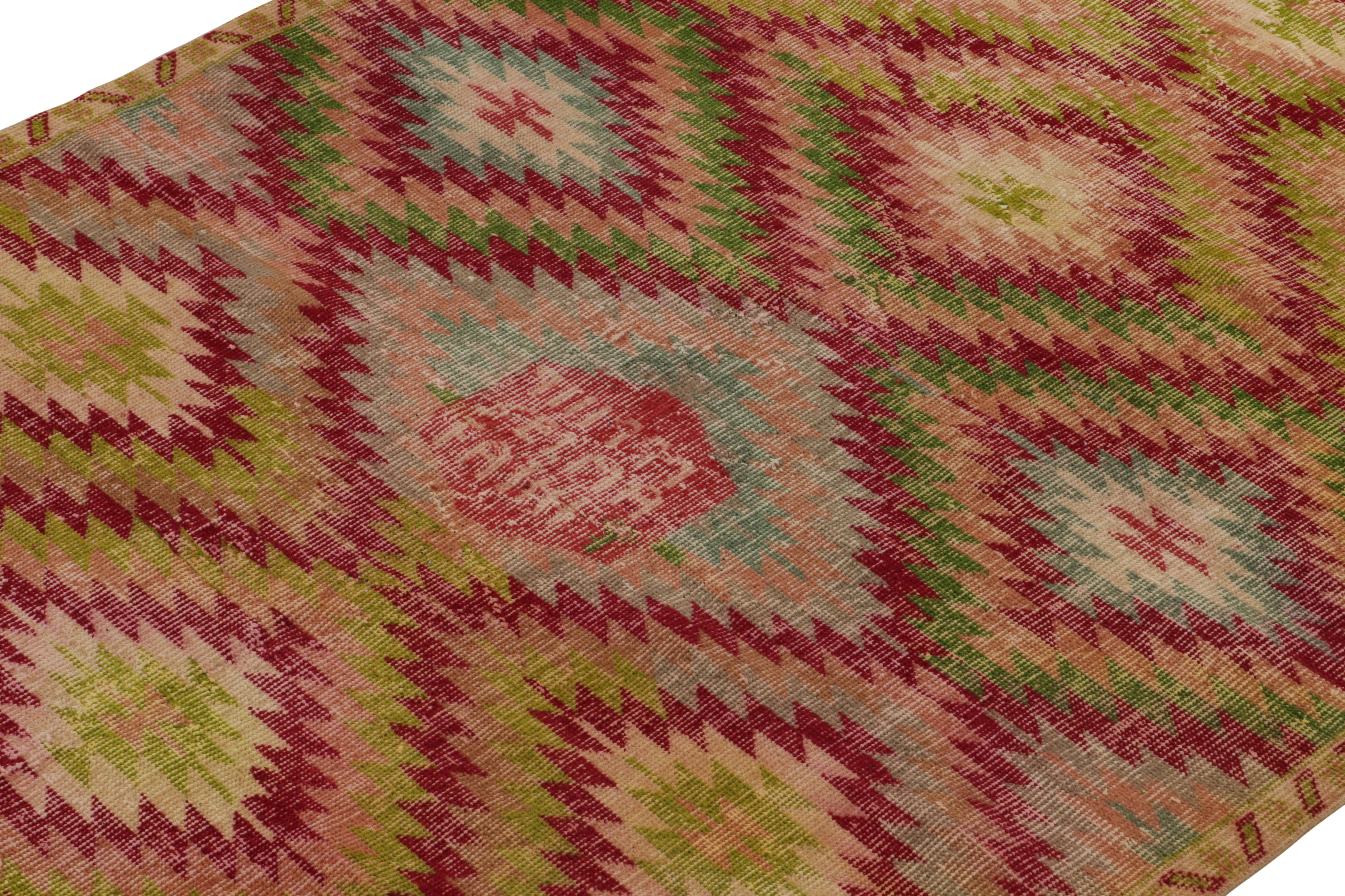 Turkish Vintage Distressed Deco Rug in Red, Green, Pink Geometric Pattern by Rug & Kilim For Sale