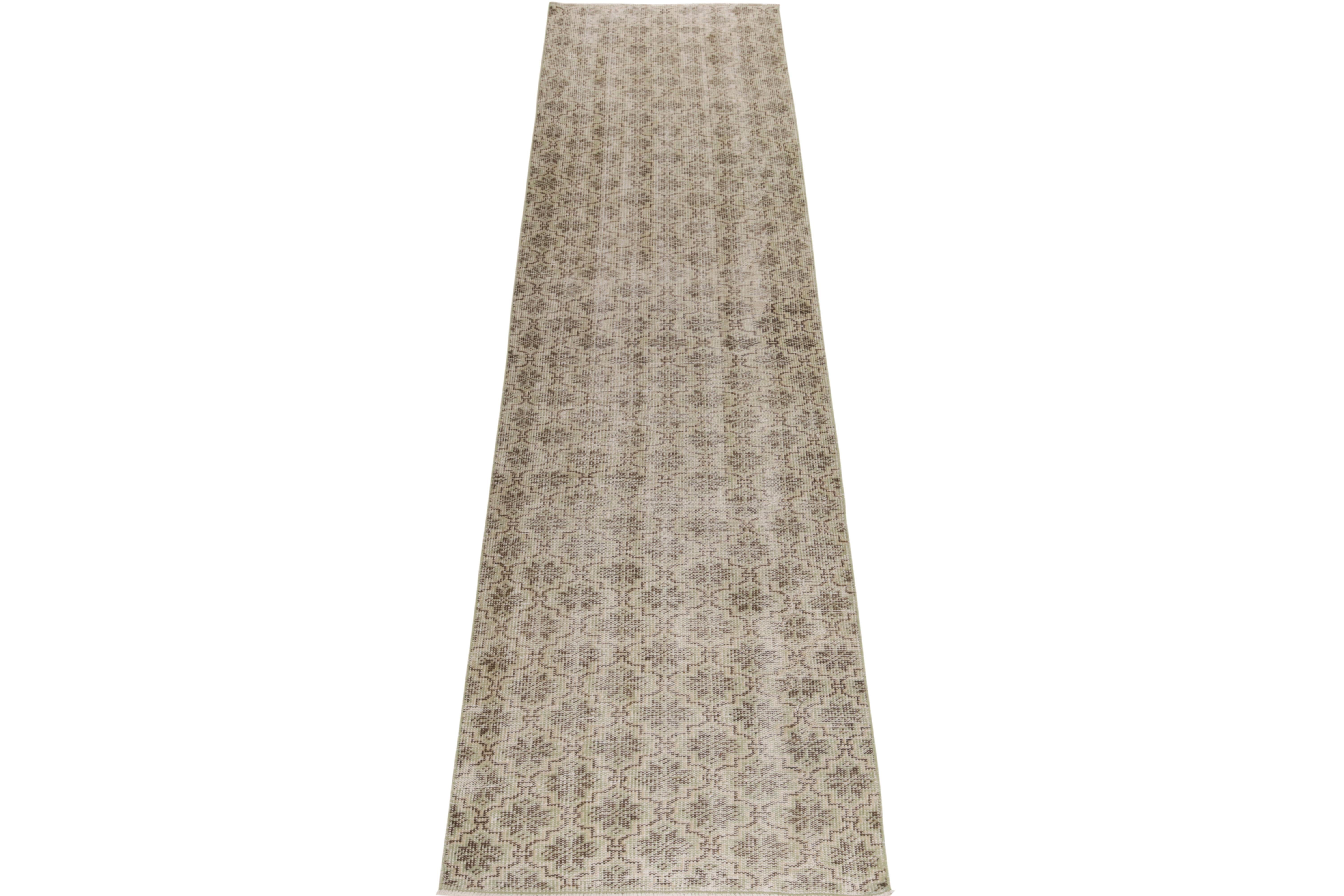 From Rug & Kilim’s commemorative mid-century Pasha collection, a 1960s vintage rug among the rare works of a Bold designer from Turkey. 

Hand-knotted in wool, this 2x11 runner enjoys an all over floral geometric pattern in pale green & beige