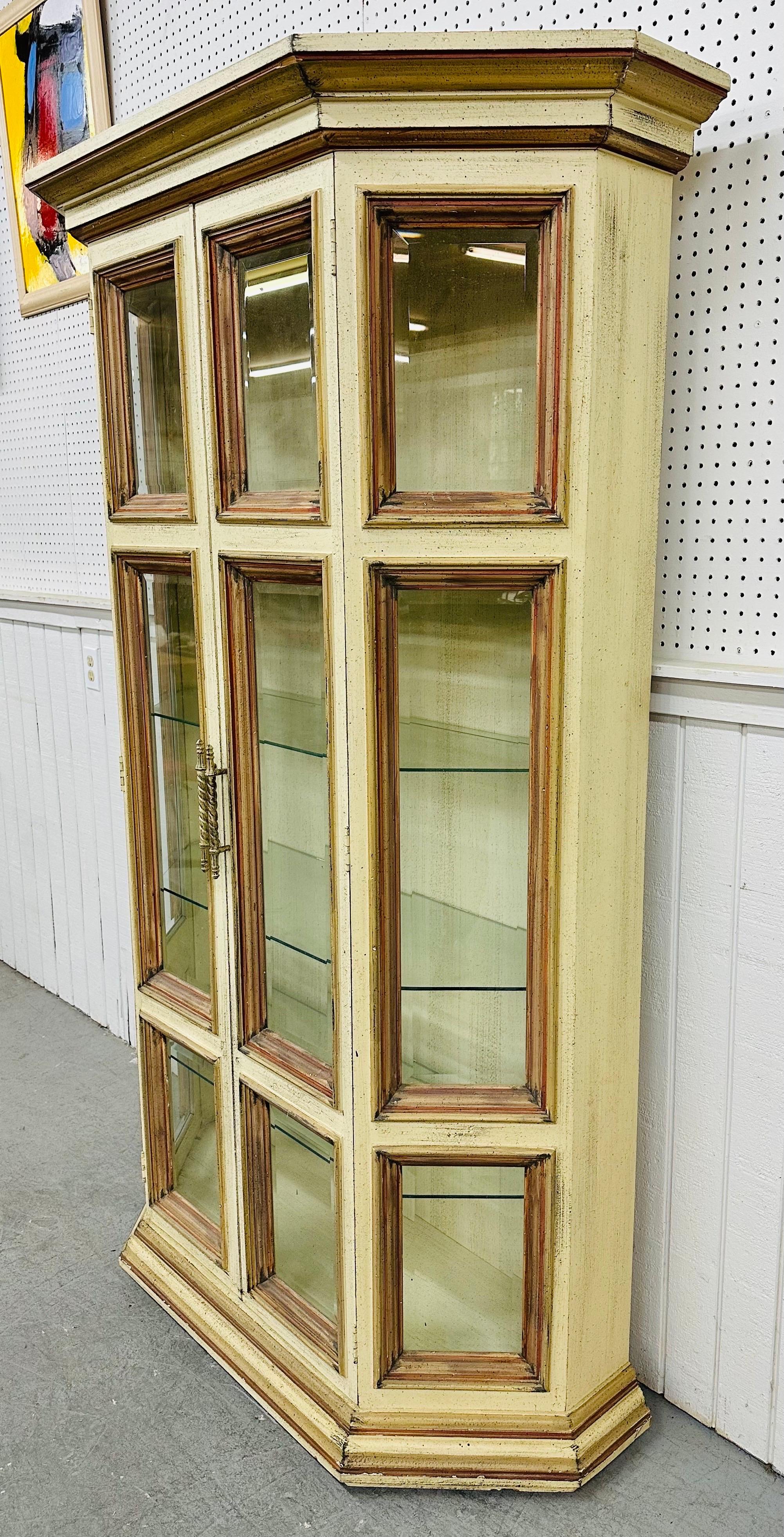This listing is for a Vintage Distressed Glass Display Cabinet. Featuring two doors that open up to removable glass shelves, interior light, multiple glass panels for display, and a beautiful antique distressed finish. This is an exceptional