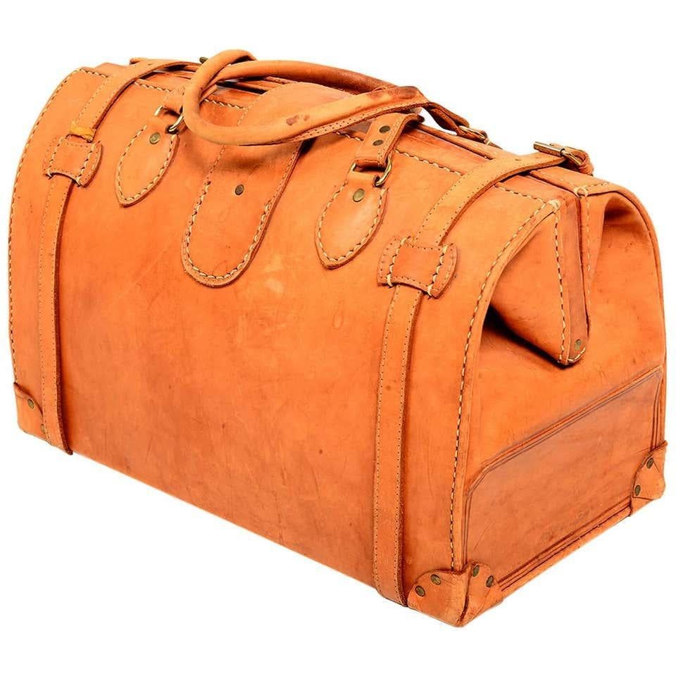 For your consideration: a vintage leather saddle bag, travel carry duffel bag, doctor's bag. Luscious Cognac color. Beautiful stitching work. Retains original lock and key. Please review all images. Vintage item in preowned condition. Wear with