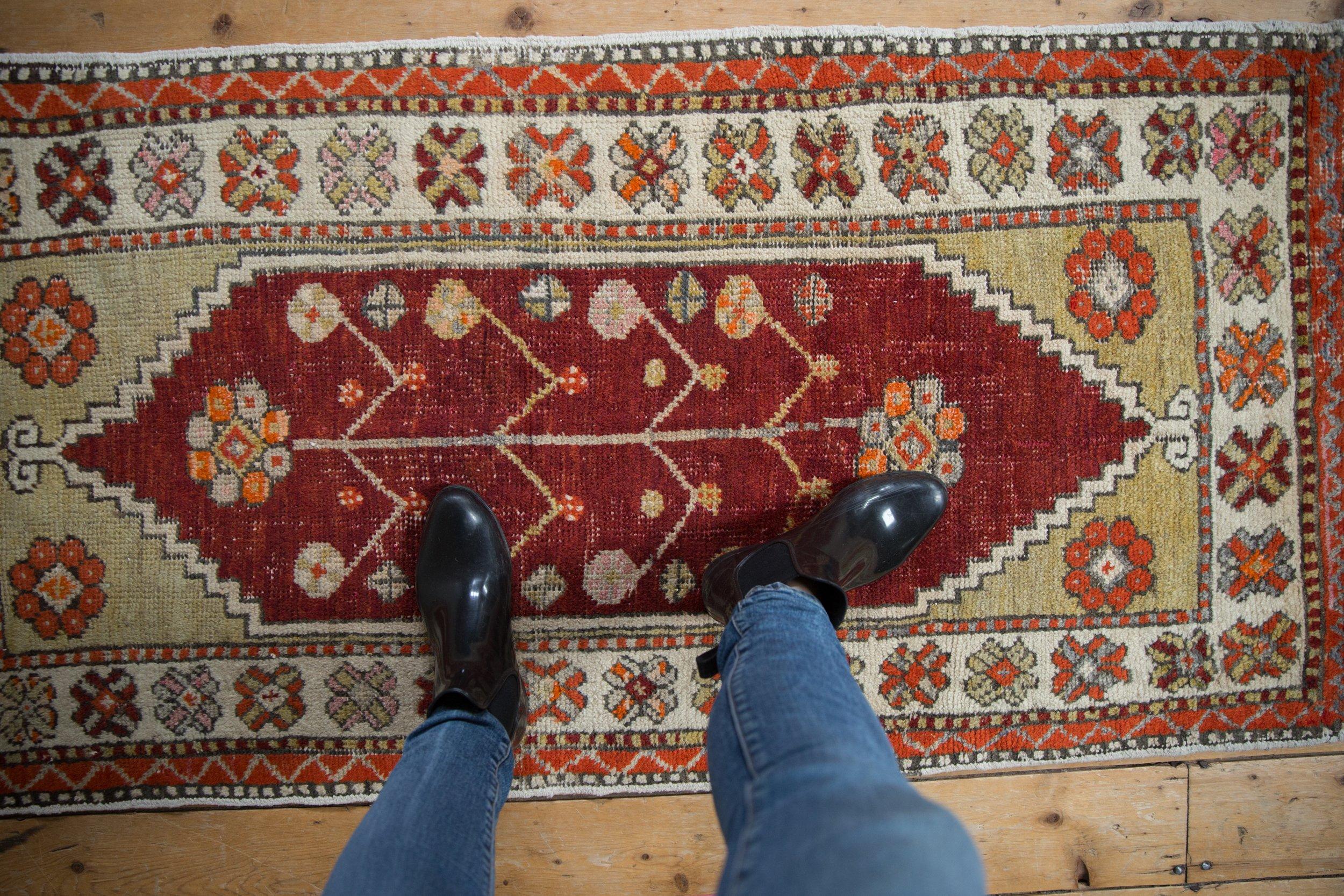 :: Center design motif of a germinating tree of life bearing blossoms and pinwheel floral buds atop an open abrashed field with stepped corner spandrels and floral top view fills. Colors and shades include: Black cherry red, ivory, beige, pale dusty