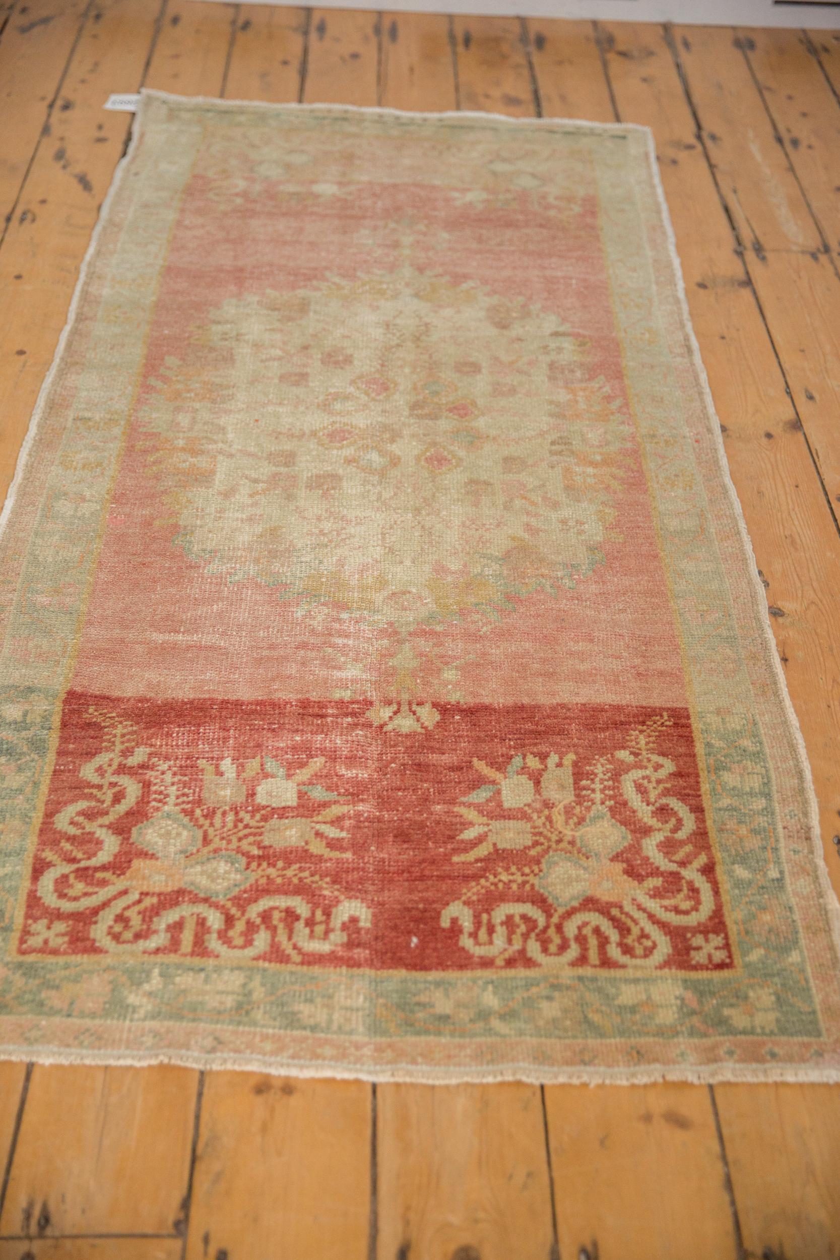 Mid-20th Century Vintage Distressed Oushak Rug Runner For Sale