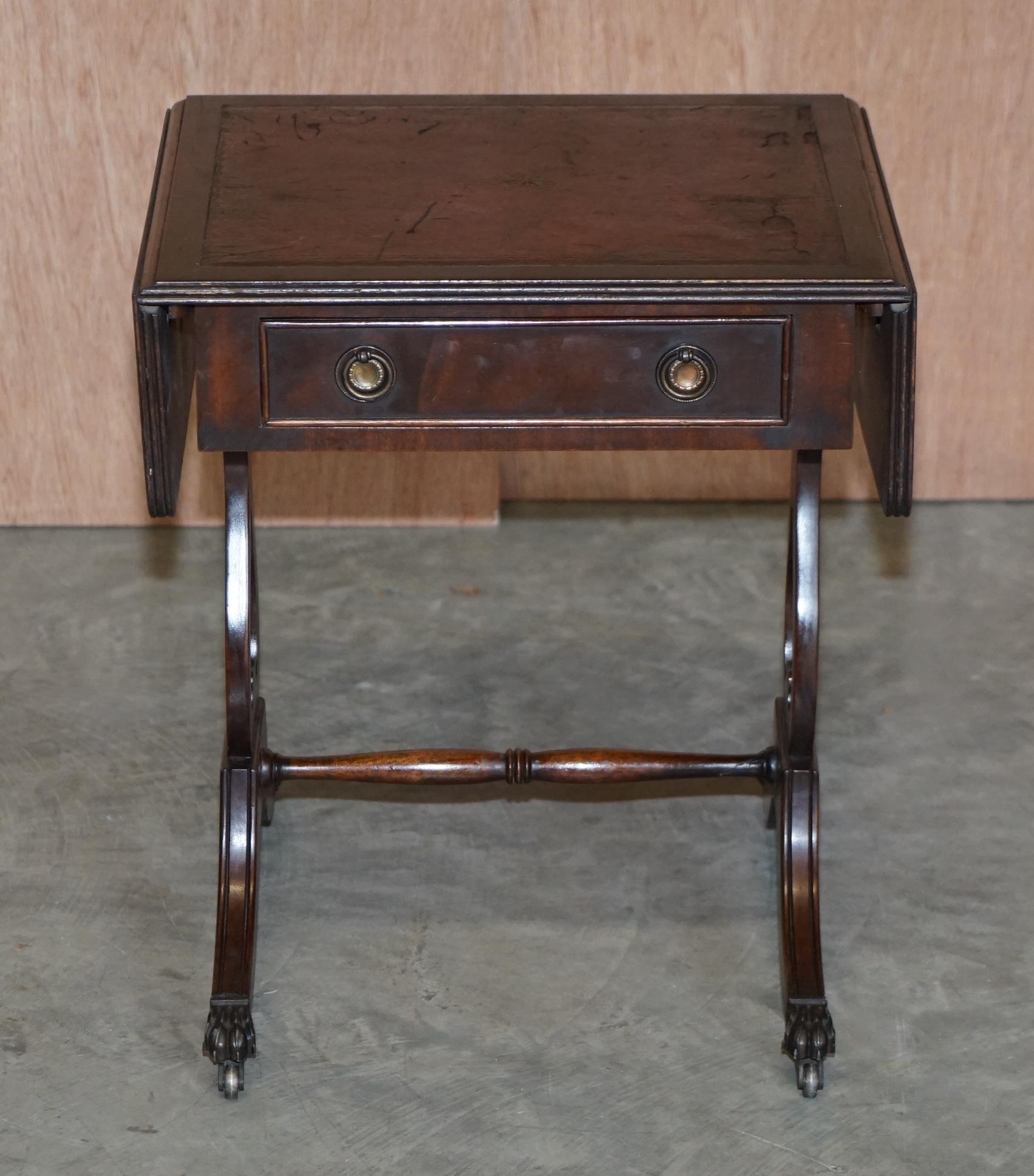We are delighted to this lovely small Bevan Funnell vintage mahogany side table with extending oxblood leather top and single drawer

A very good looking and versatile piece, the table has single drawer to the front and false drawer to the back so
