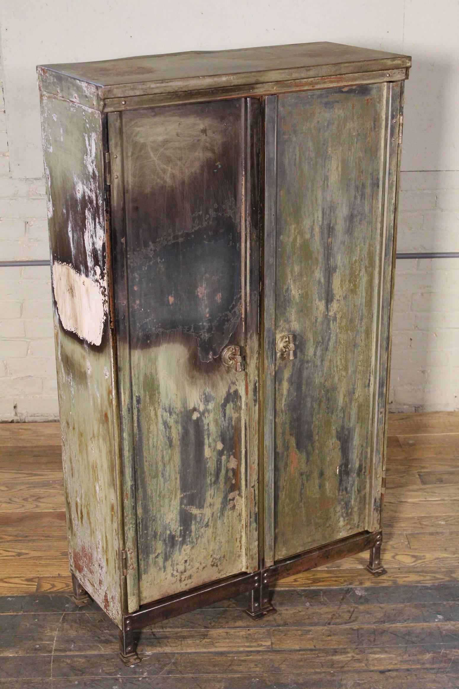 Vintage distressed painted metal storage cabinet / locker. Has been cleaned inside and out and is ready for use.
