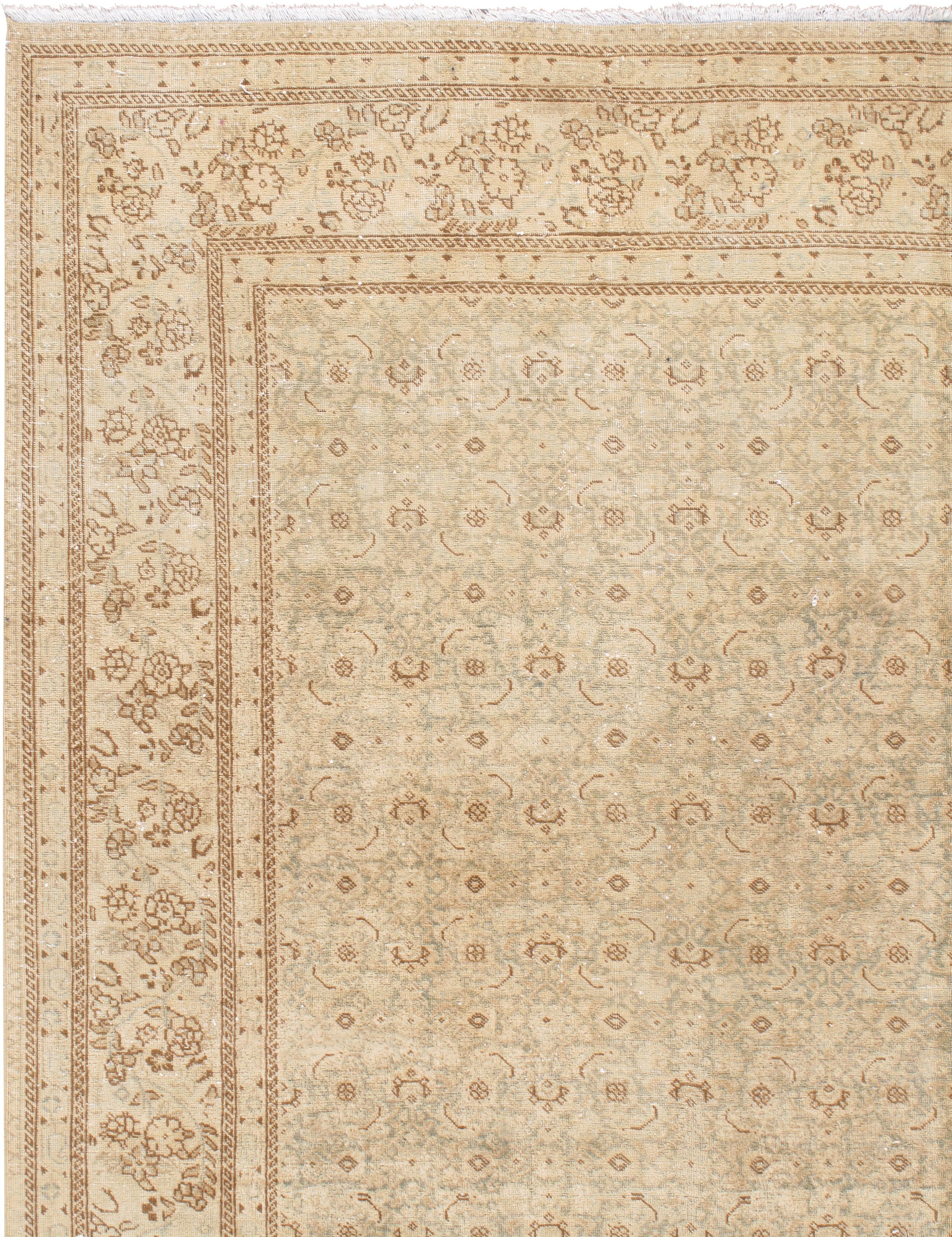 Vintage distressed Persian Tabriz rug carpet, circa 1920, measures: 8'5 x 14'10. A distressed carpet is not an abused one, but one that has been artfully recreated to follow current decorating style trends. Lida Lavender’s distressed carpets are