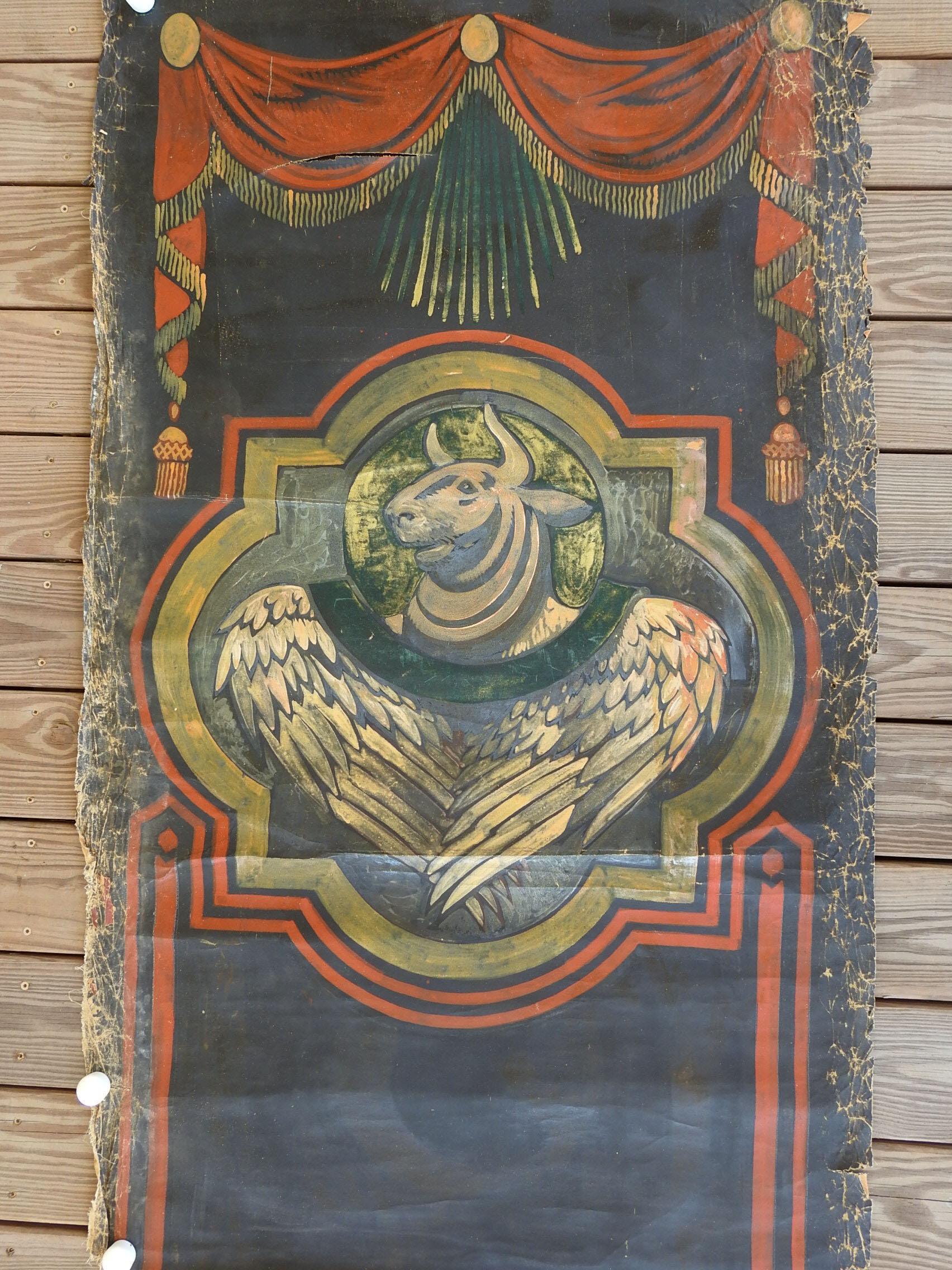 Vintage oil on canvas painting of the winged ox or bull of St. Luke by Geneva Flores Hart Fell (1906 - 2008) Texas. Black, dark terracotta and gold ox set inside quadrefoil with swags at top on flat canvas, likely for interior cathedral wall