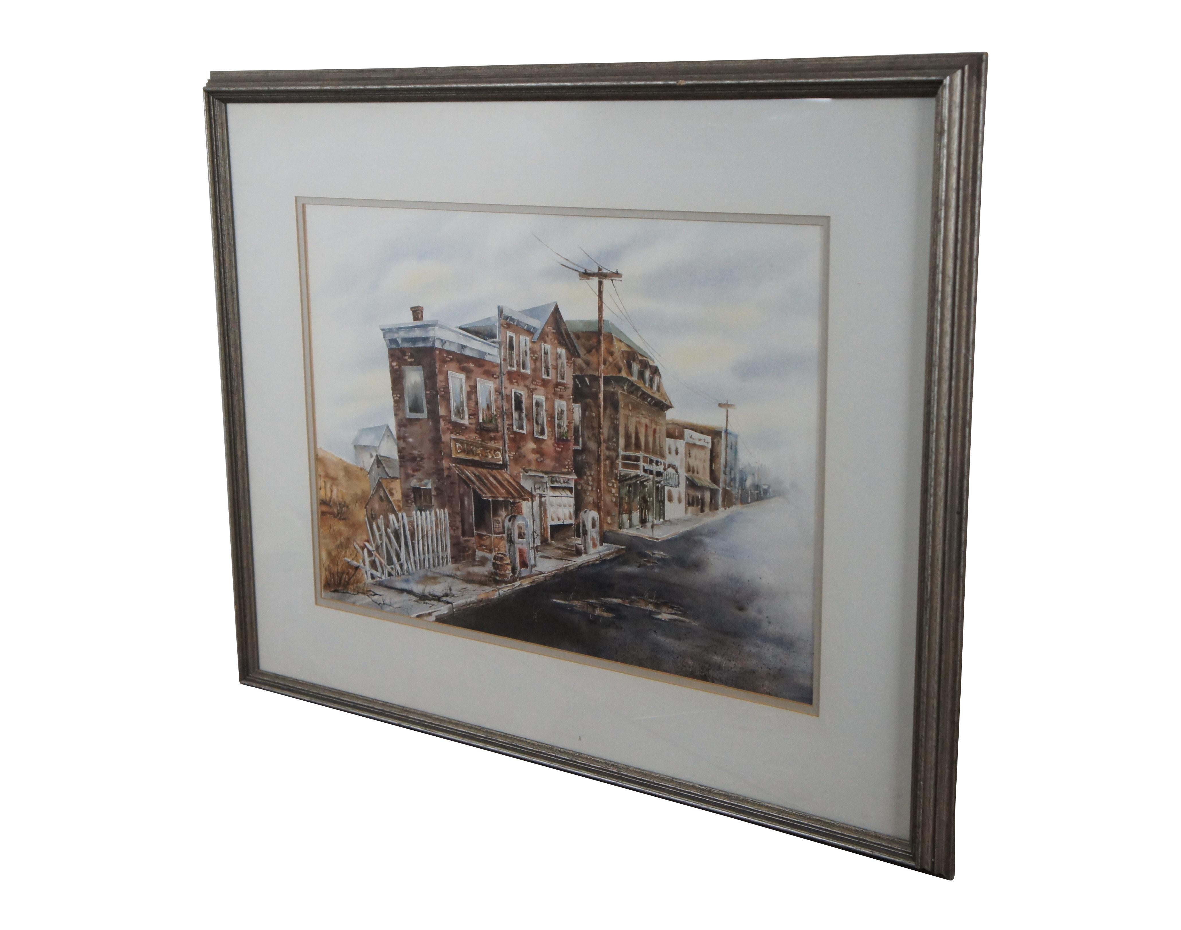 Vintage watercolor painting depicting a run down stretch of Dixie Highway or US 150. No signature. Framed in a lightly distressed, silver gilt frame with raised bevel. 

Dimensions:
29.5