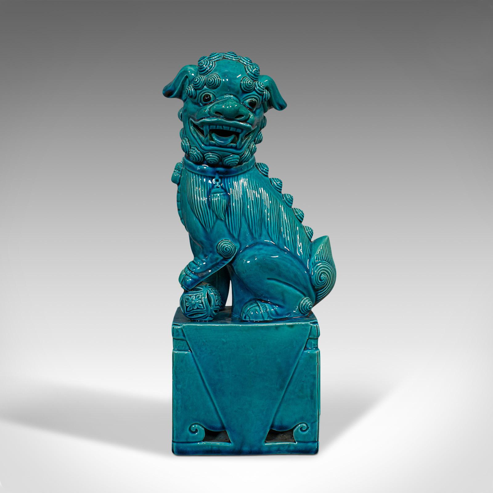This is a vintage dog statue. An Oriental, ceramic decorative 'Dog of Fo' ornament dating to the late Art Deco period, circa 1950.

Radiant in superb cerulean blue
Displays a desirable aged patina
Ceramic in good order with rich colour and