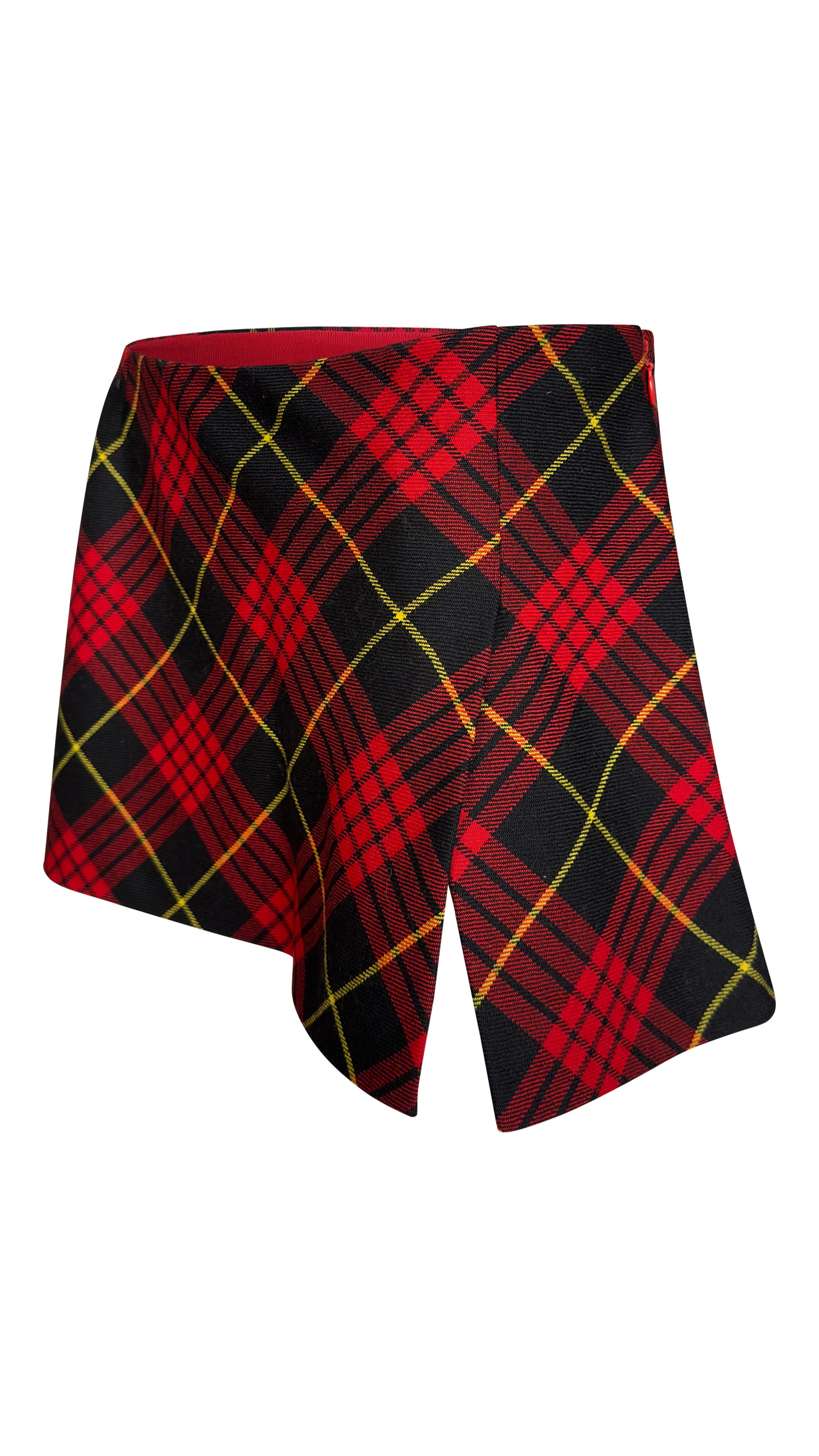 The skirt has a micro mini length in gorgeous vintage red and black tartan. This skirt has a slit on the left side. 
~Pristine conditions
~100% wool 
~Made in Italy 
~Size IT42 but fits size S -UK 8 