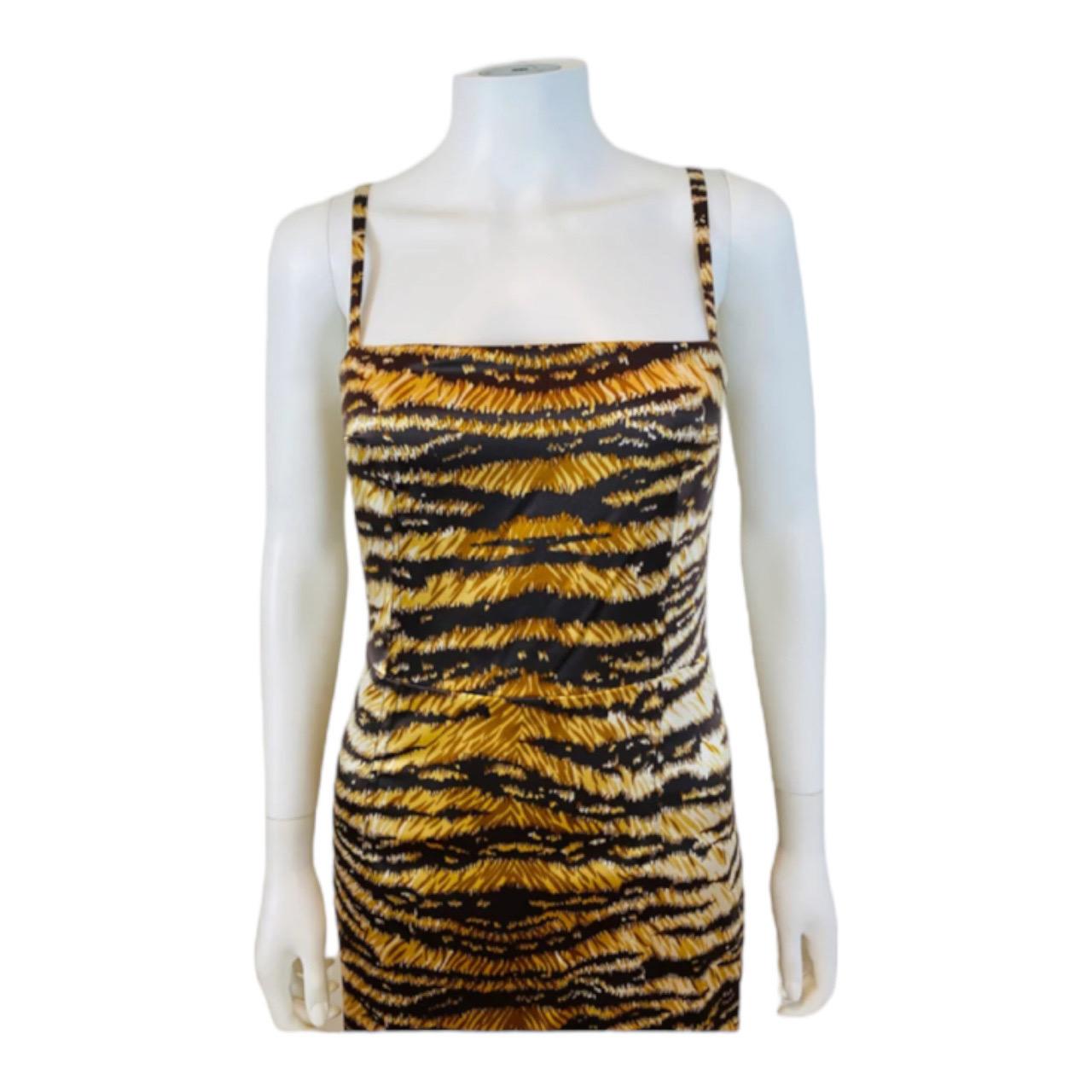 Vintage Dolce + Gabbana Dress
Stretch silk bold tiger stripe print
Thin shoulder straps
Fitted bodice with darts at the bust
Wiggle fit
Tapered knee length skirt with slit at the bottom hem
Hidden zipper up the back 
Fully lined
Original tags