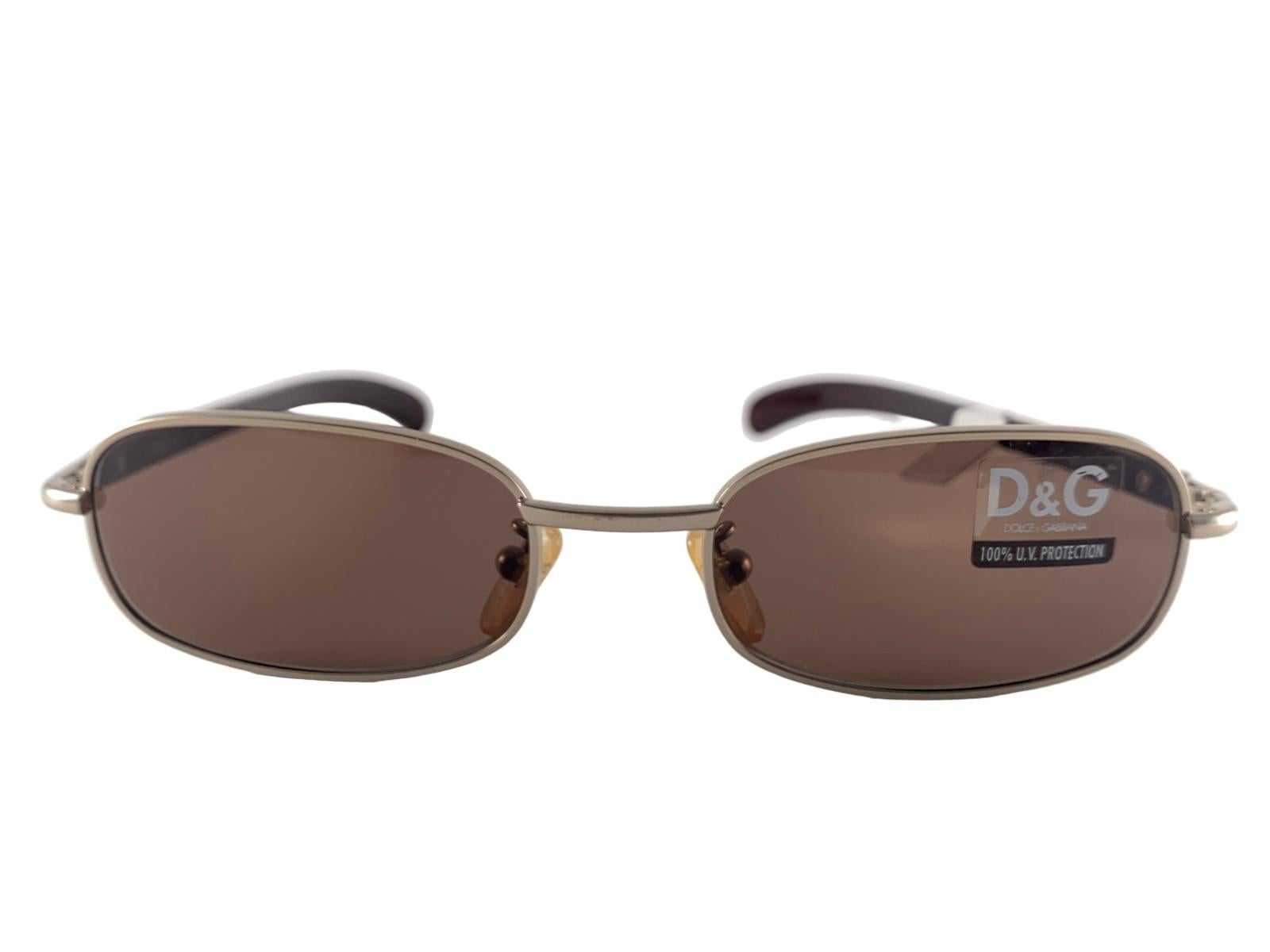 Eye Catching Dolce & Gabbana bronze rectangular frame with brown lenses.

New! Never Worn Or Displayed

This Item May Show Minor Sign Of Wear Due To Storage.


FRONT : 14  CMS


LENS WIDTH : 5.5 CMS


LENS HEIGHT : 2.8 CMS


TEMPLES : 14 CMS