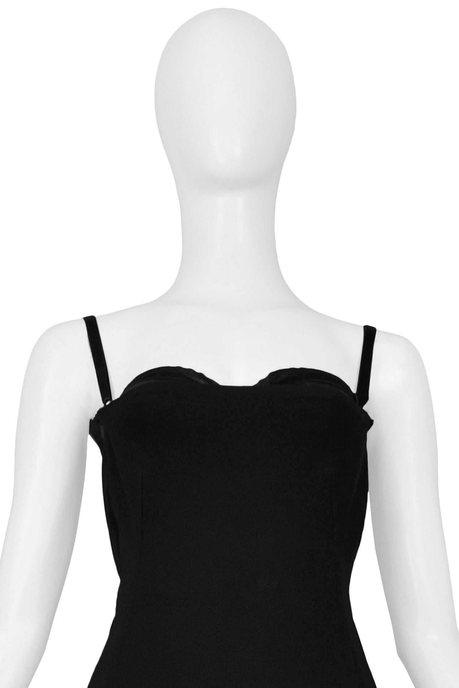 Resurrection Vintage is excited to offer a vintage Dolce & Gabbana black jersey cocktail dress with an open back and multiple straps, an exposed interior bra with adjustable straps, and a center back skirt zipper. 

Dolce & Gabbana
Size: