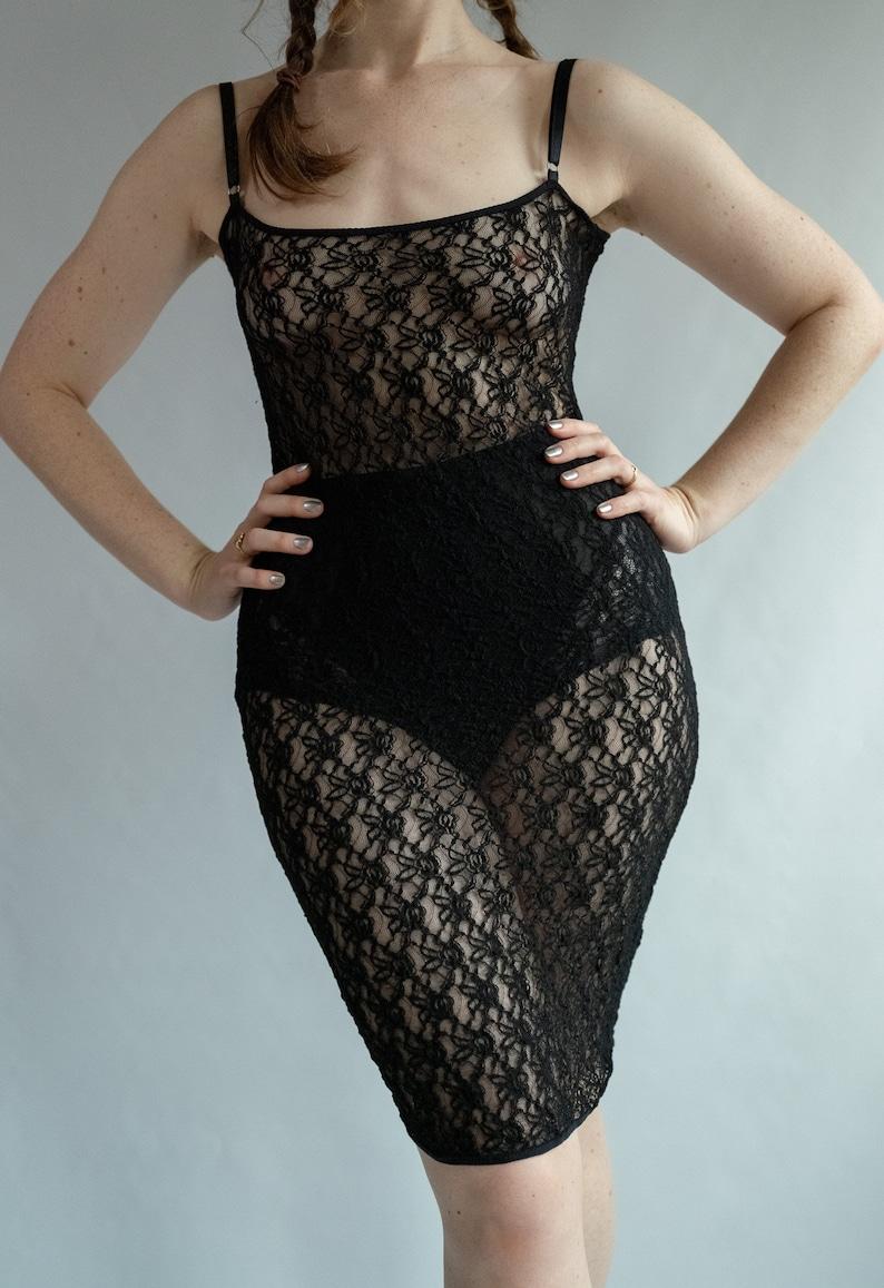 Vintage Dolce & Gabbana Black Lace Slip Dress 
Really cute and fun 
THE PERFECT CUT 
really elegant on its own or layered

No size tag 
Our fit estimate: 6-12 DODF as has lots of stretch 
Pictured on size 12 5’7 


Very Good vintage condition, light